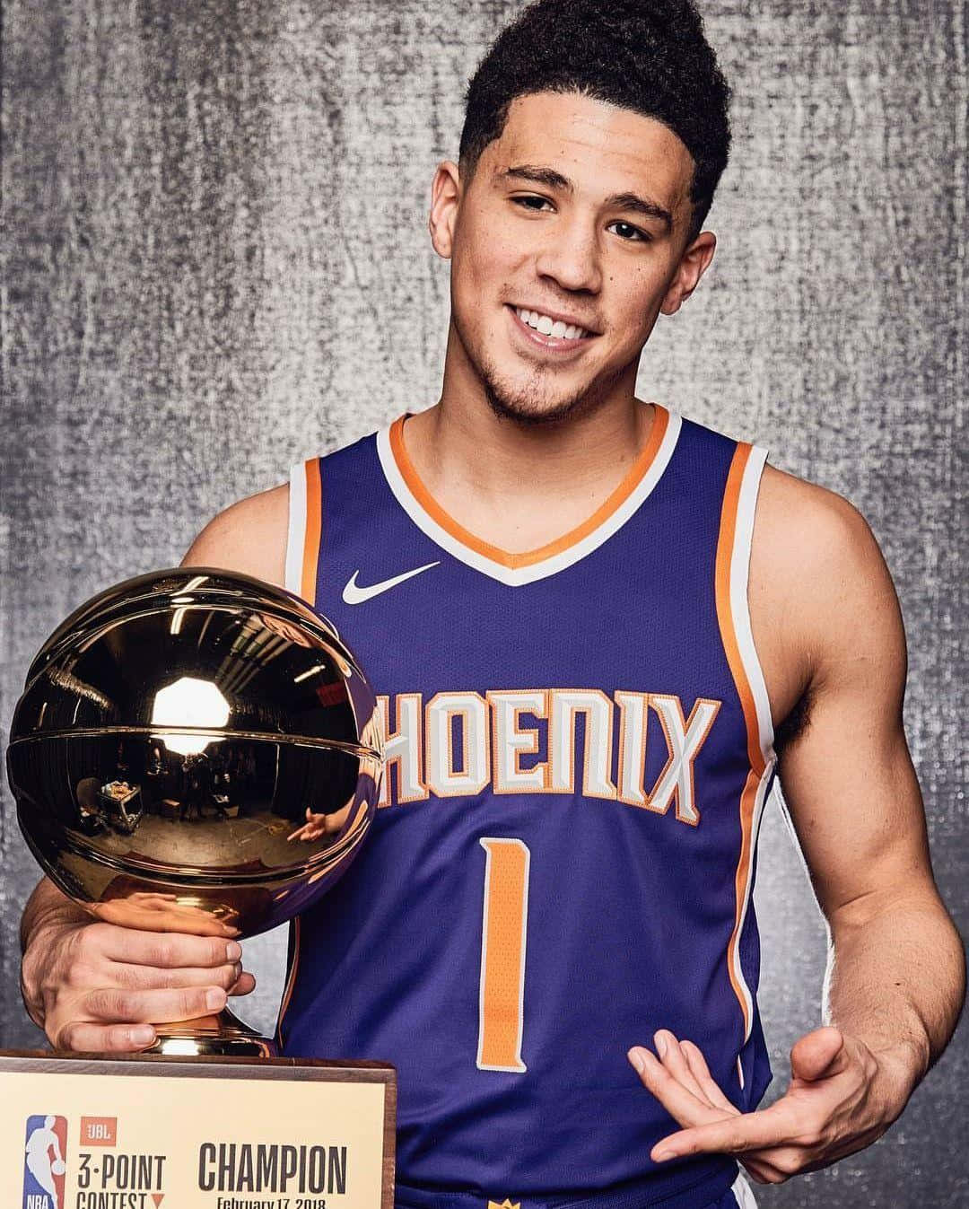 NBA All-Star Devin Booker with his Iphone Wallpaper
