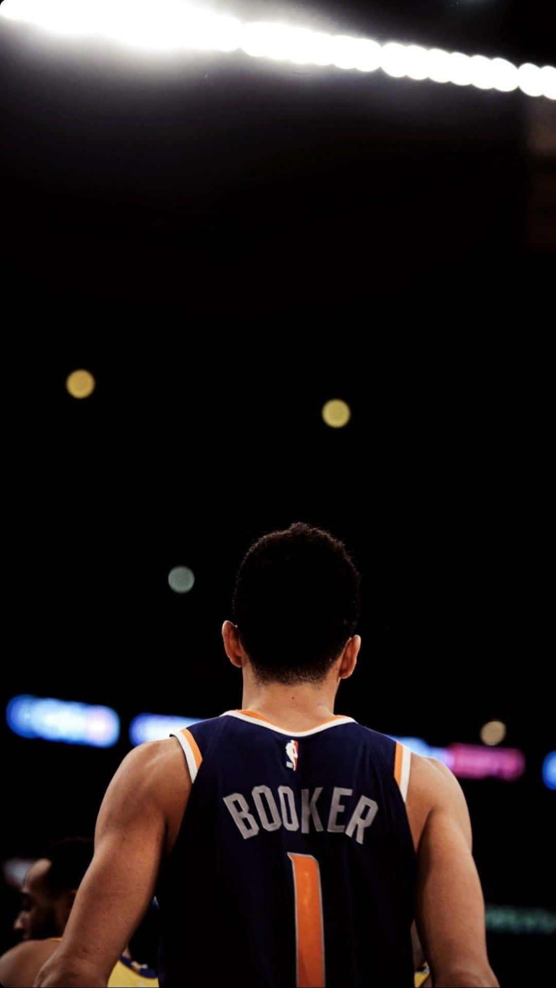 Phoenix Suns Star Devin Booker Right Before Action Wallpaper