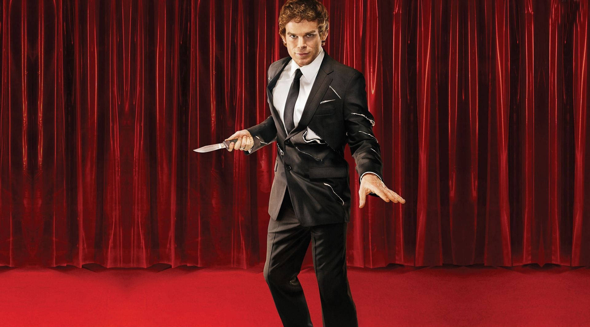 Dexter Morgan - Consummate Professional Against a Red Curtain Background Wallpaper