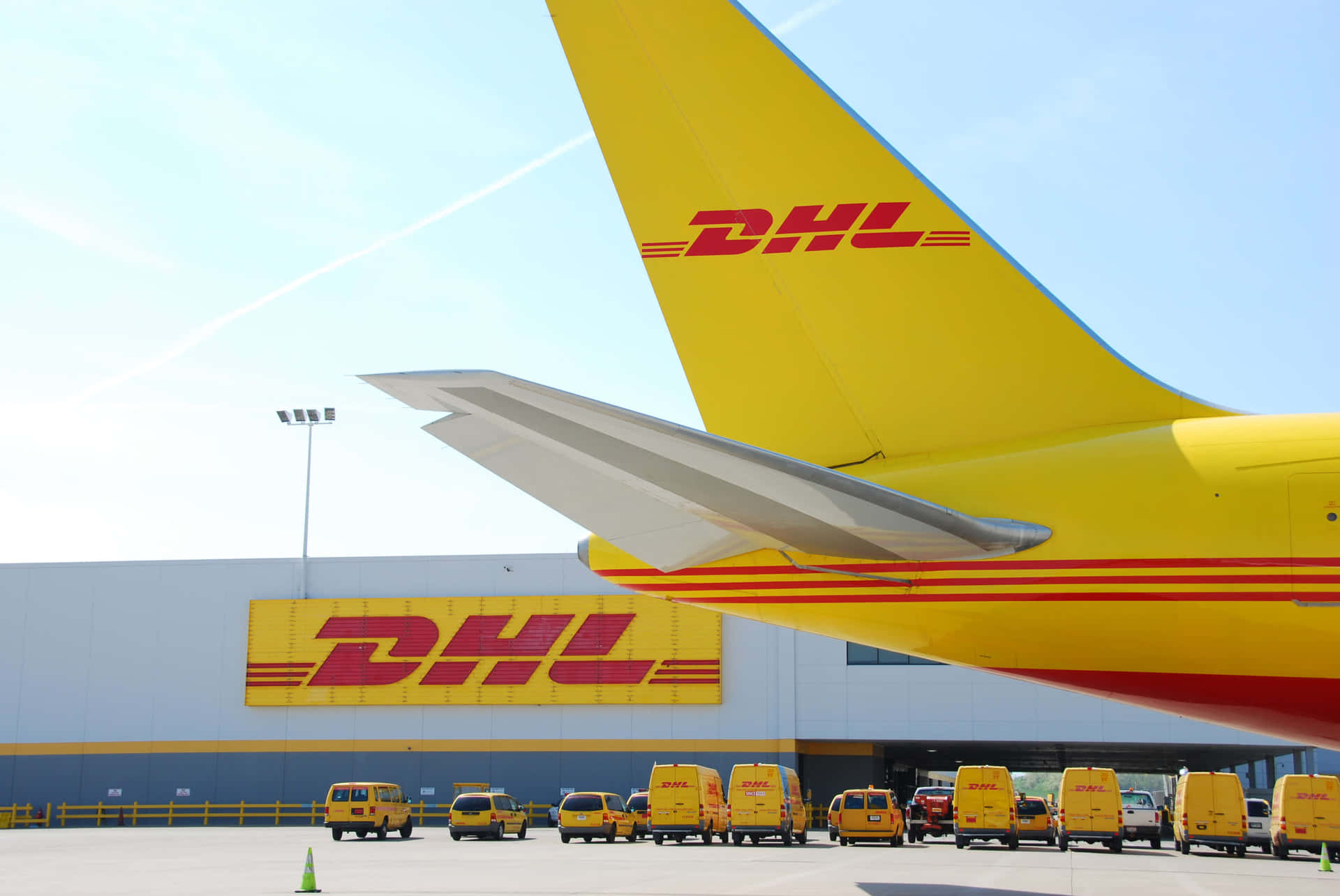 A Yellow And White Dhl Plane