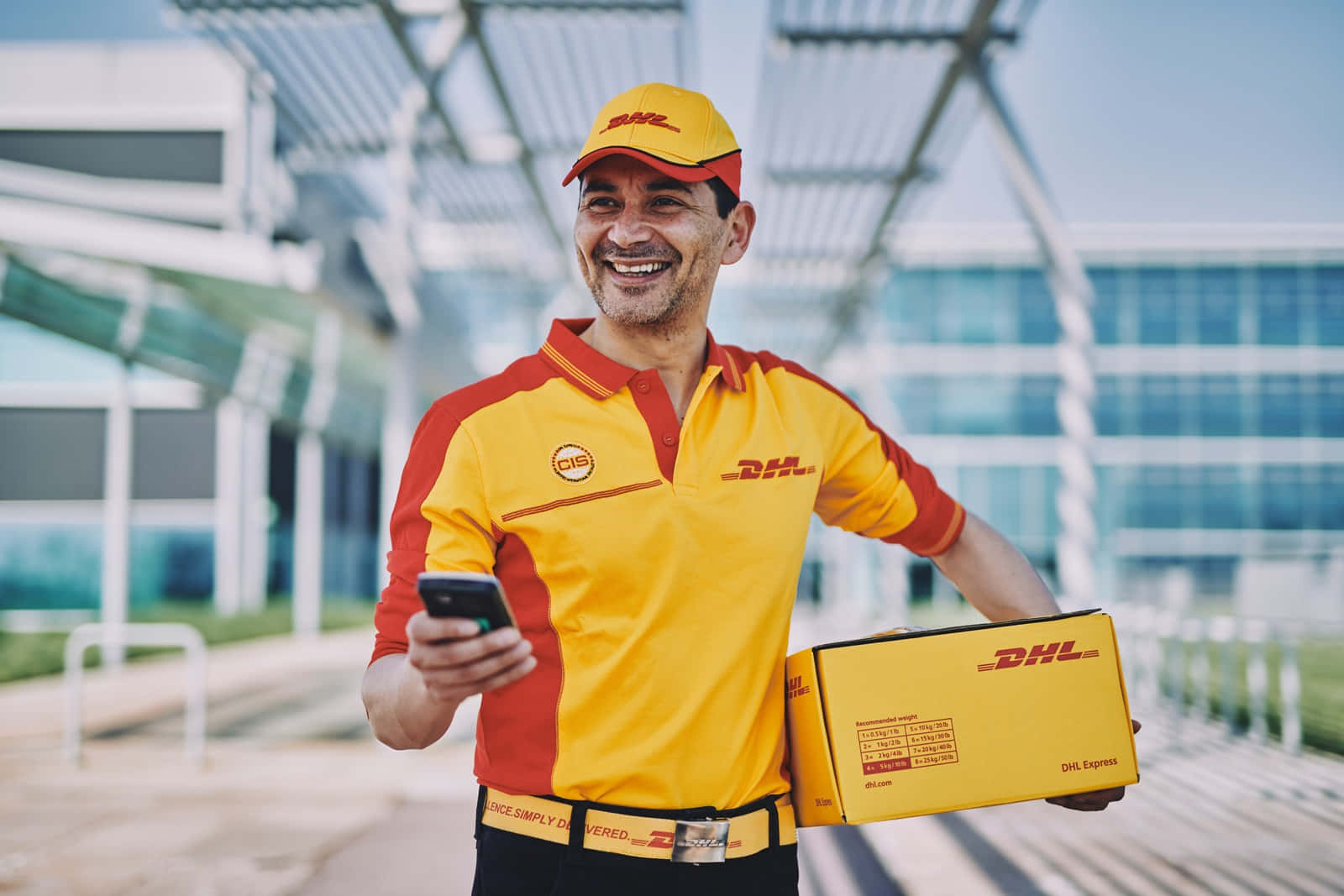 Dhl Delivery Man Holding A Package