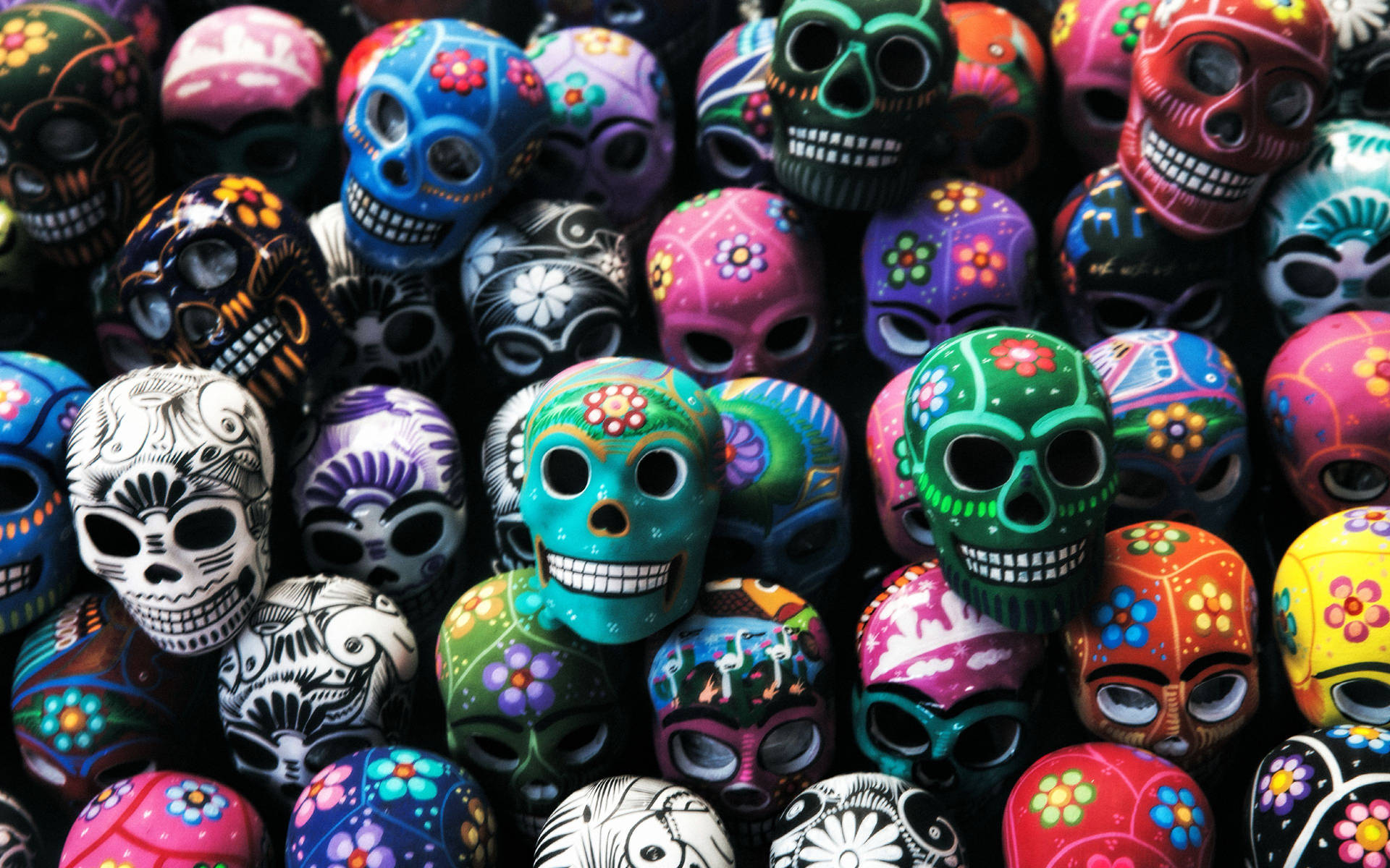 Dia De Los Muertos Smiling Skulls Close-Up Wallpaper