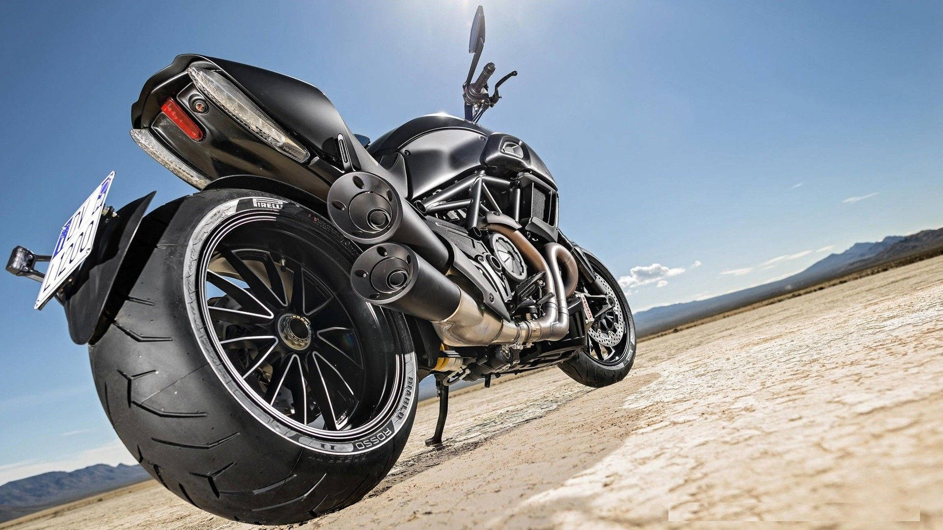 Take The Road in Style - Diablo Rosso on a Motorbike Wallpaper