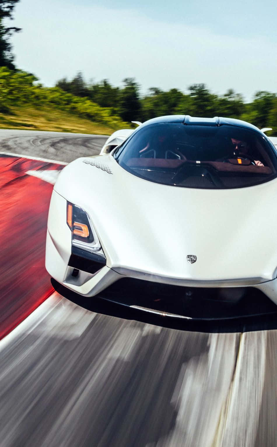 The White Supercar Is Driving Down The Track Wallpaper