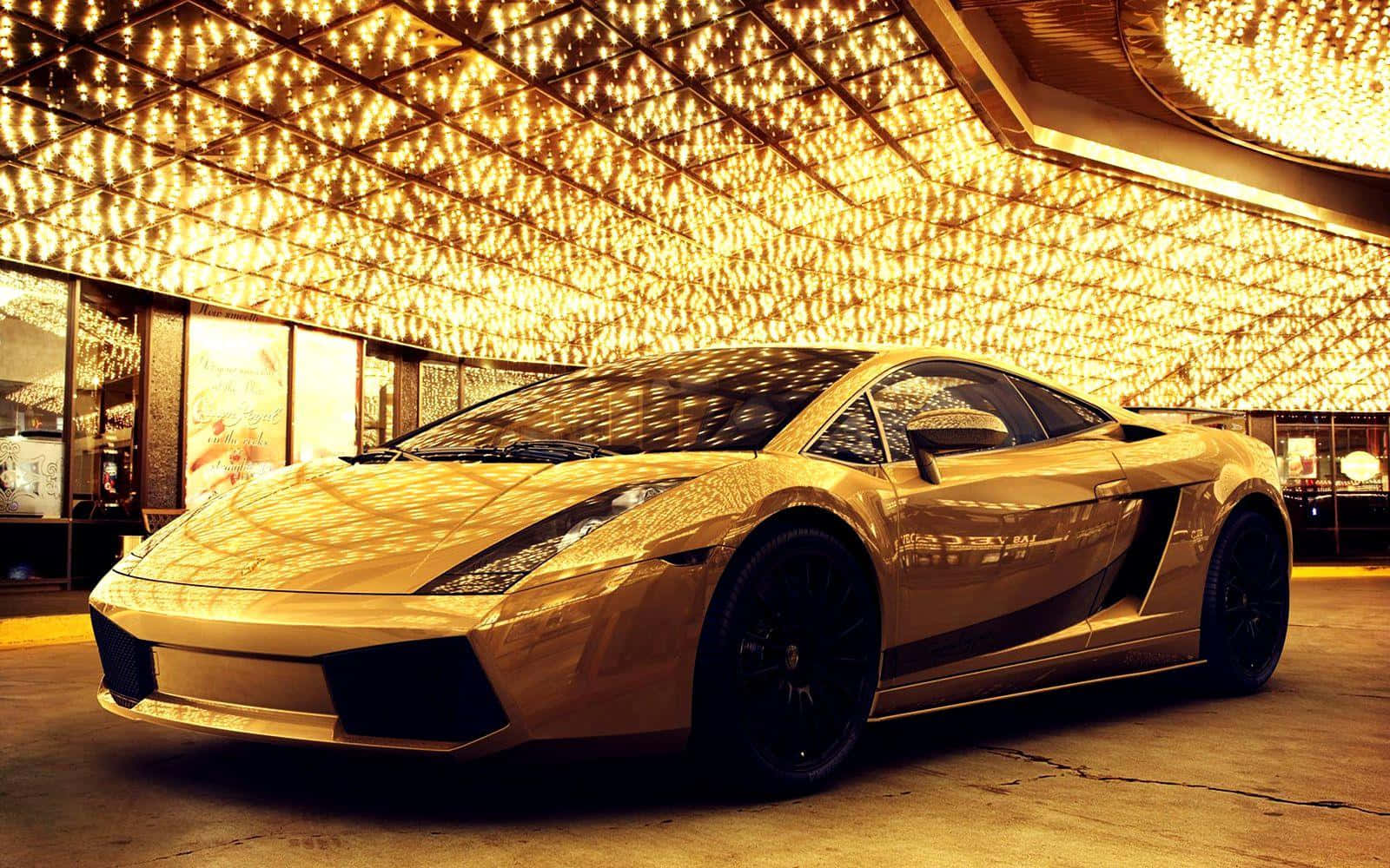 A Gold Sports Car Parked In A Casino Wallpaper