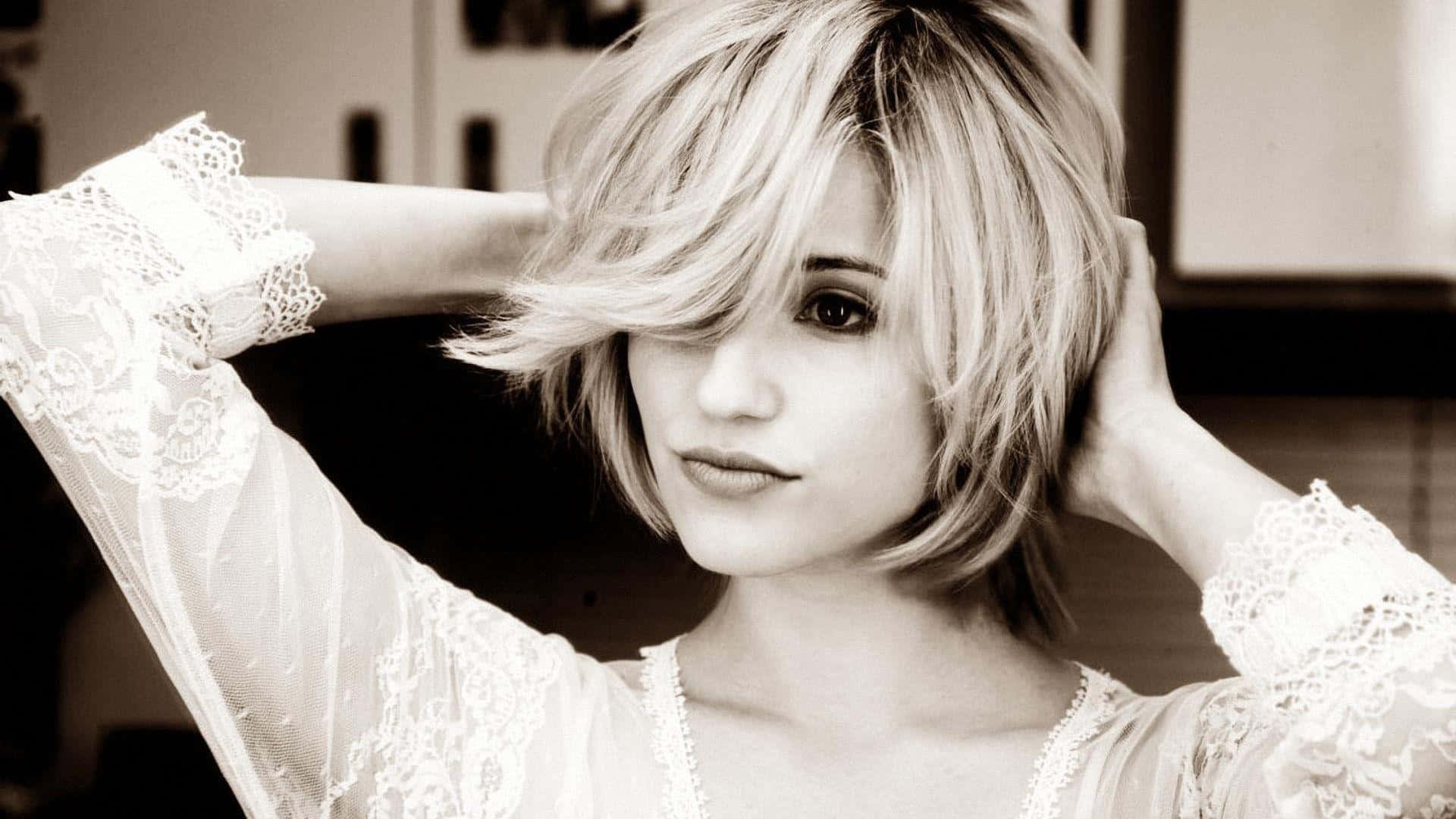 Dianna Agron captivating smile in a close-up portrait. Wallpaper