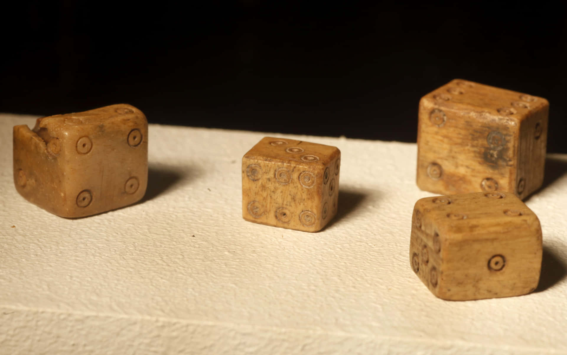 A Set Of Wooden Dice On A Table