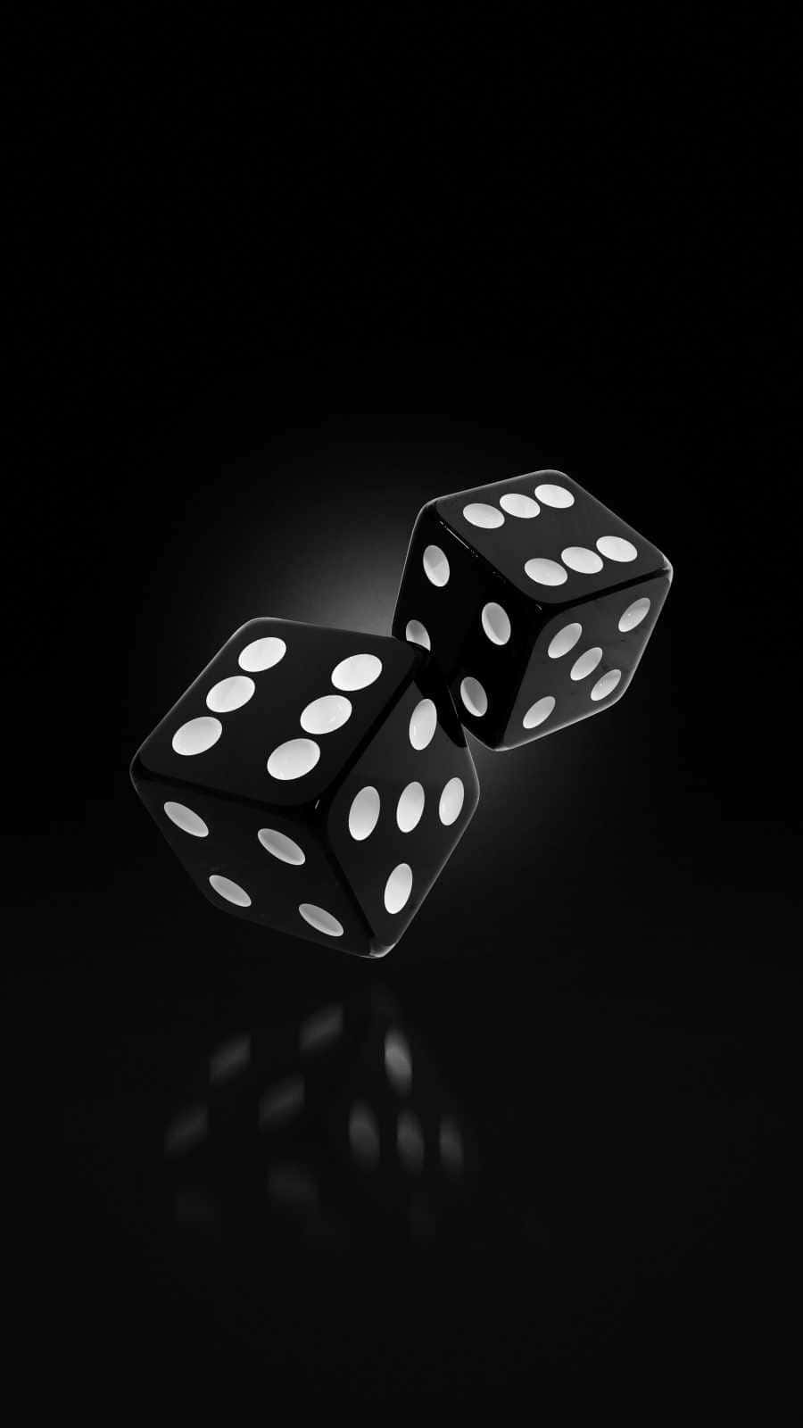 Two Black Dice On A Black Background