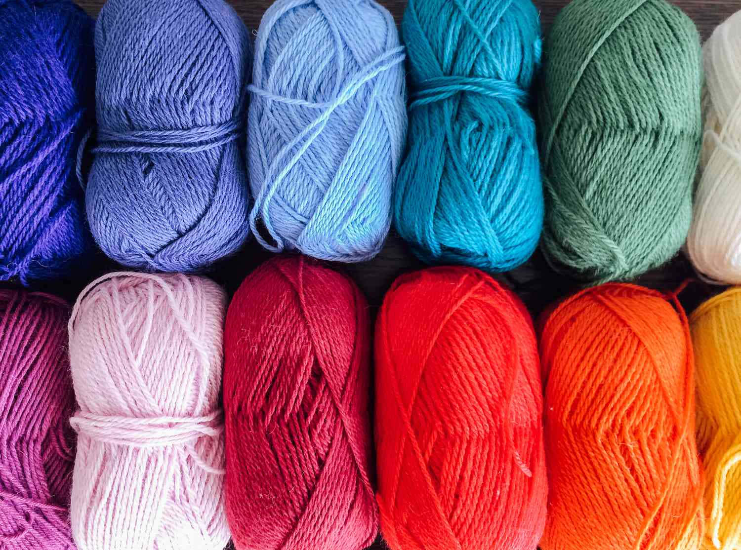 Different Shades Of Knitting Yarn Skeins Wallpaper