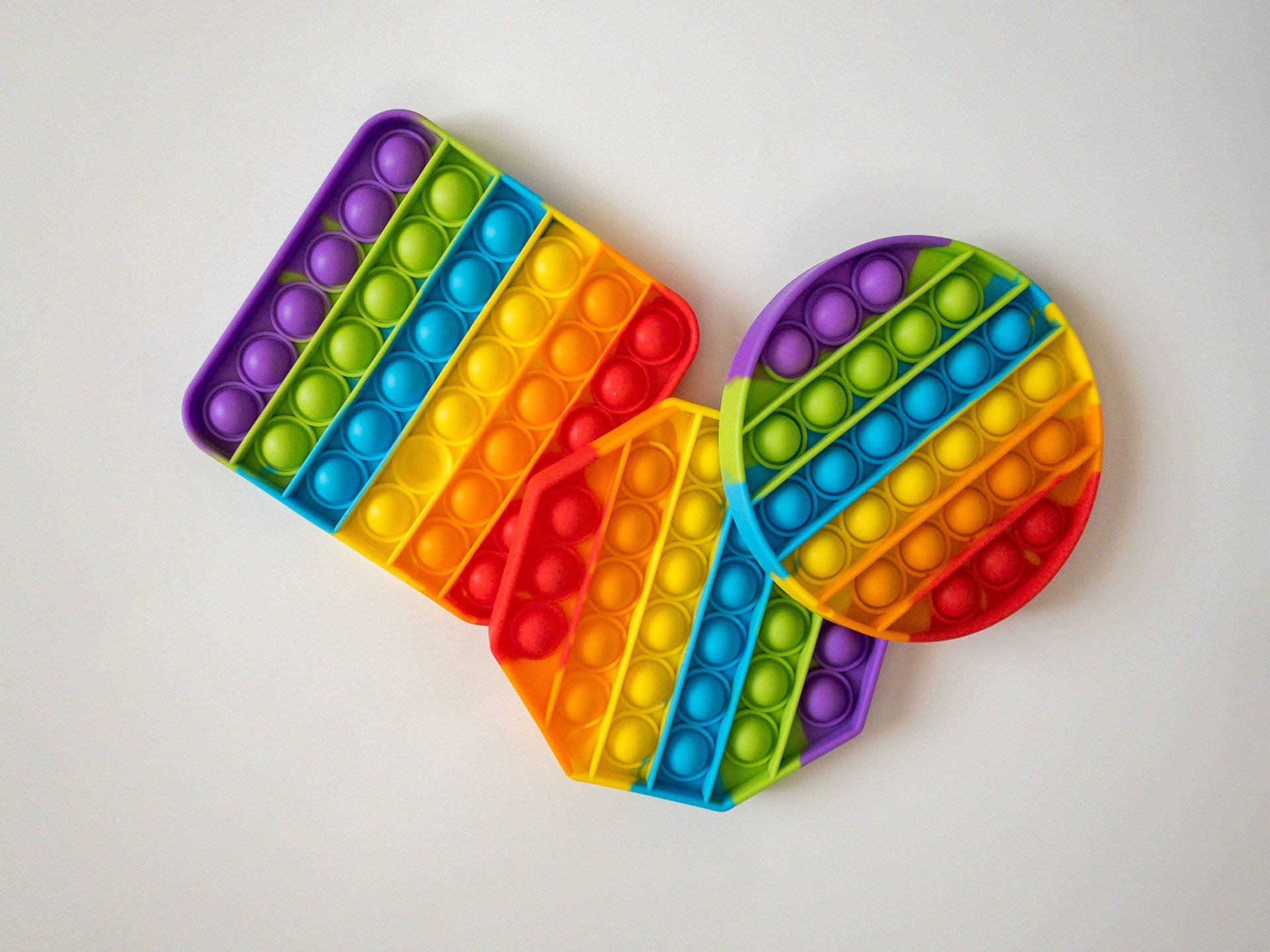 Colorful Pop It Fidget Toys in Various Shapes Wallpaper