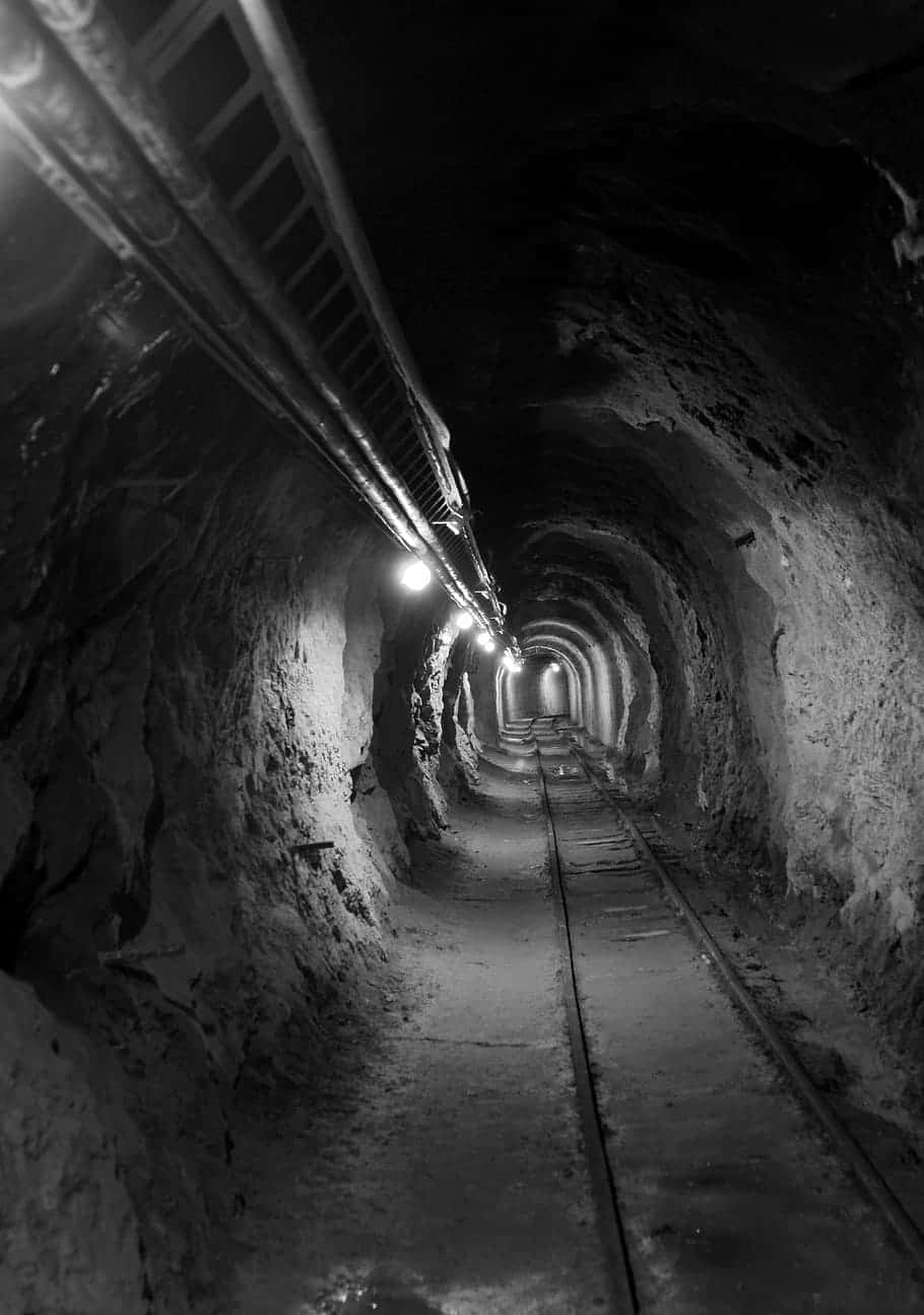 Dimly_ Lit_ Mining_ Tunnel Wallpaper