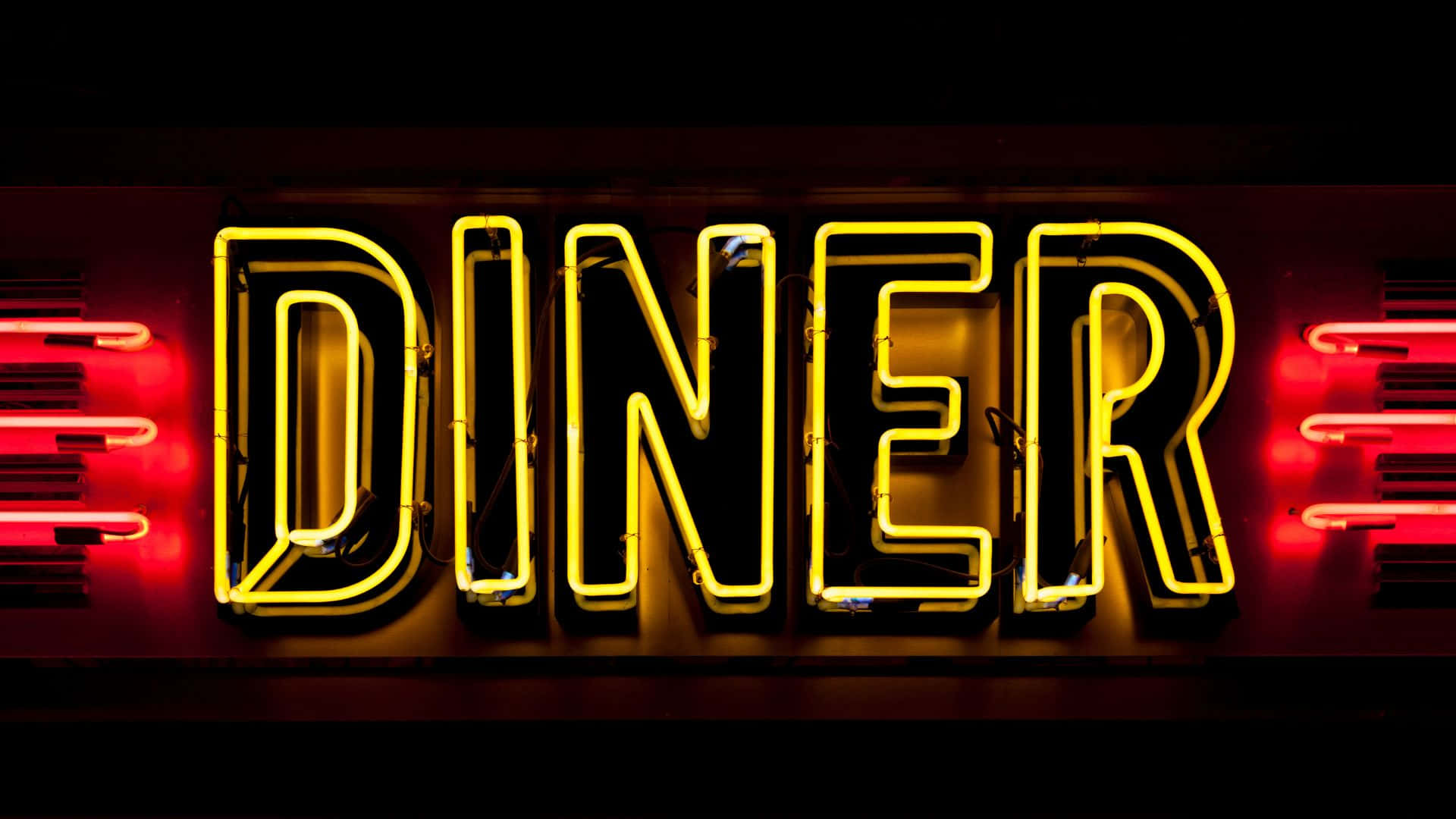 Retro Diner Interior with Red Booths and Neon Lights