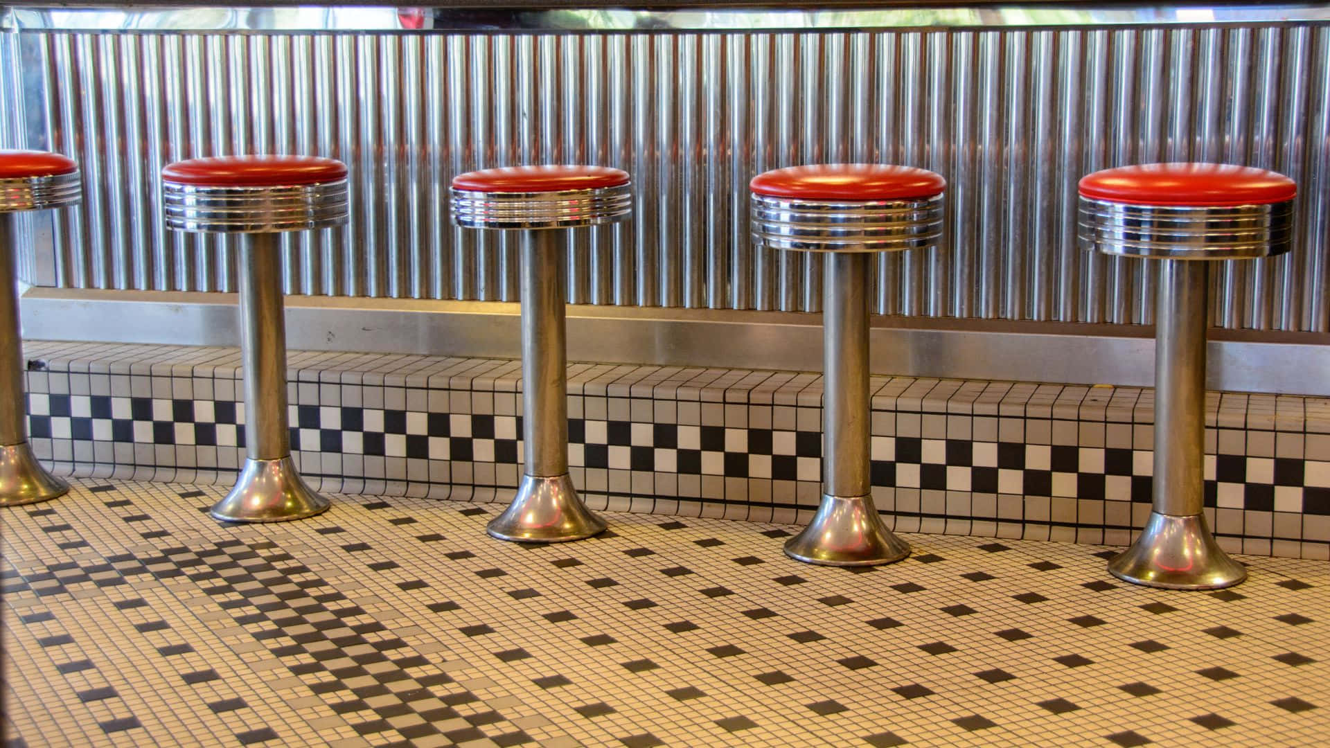 Retro Diner Scene with Red Booths and Jukebox