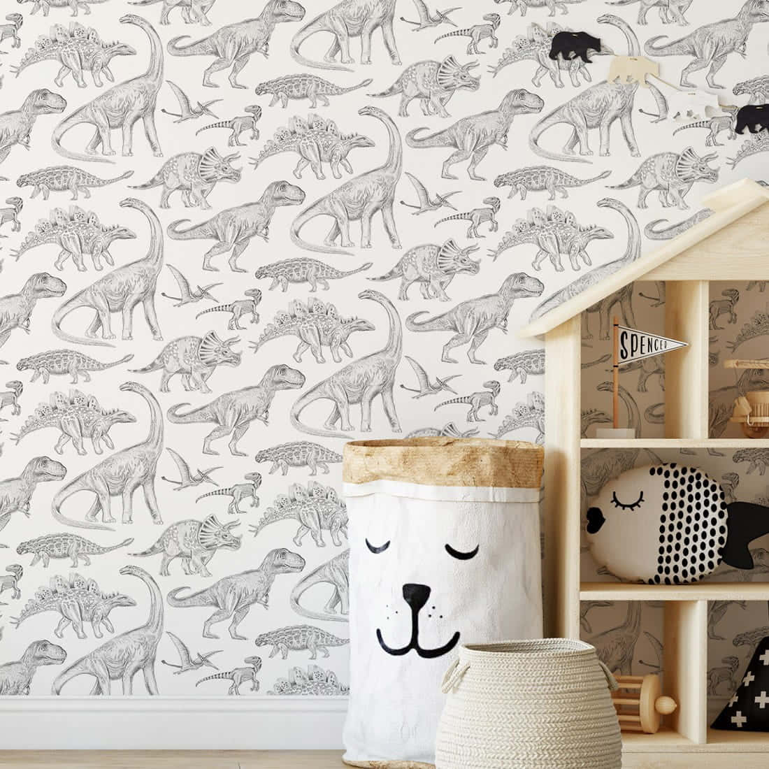 a child's room with a dinosaur wallpaper