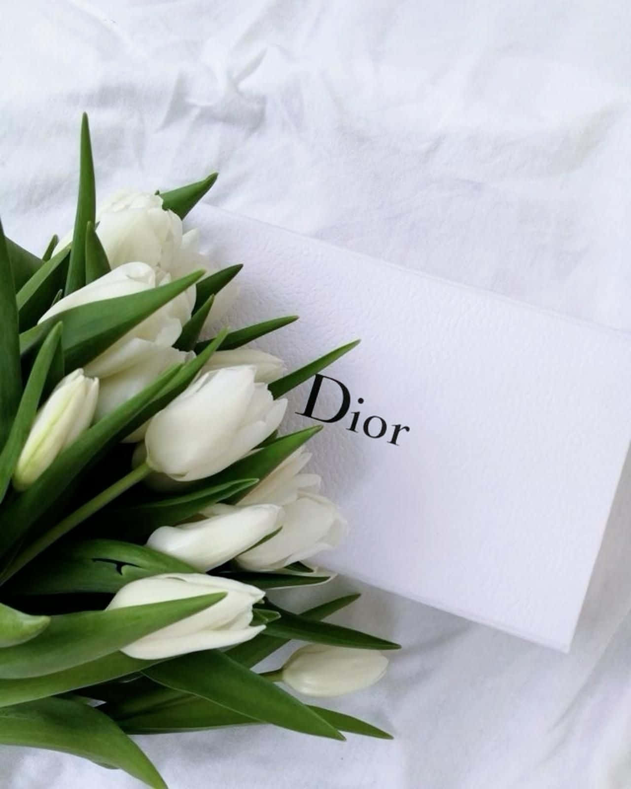 Dior Branded Card With White Tulips Wallpaper