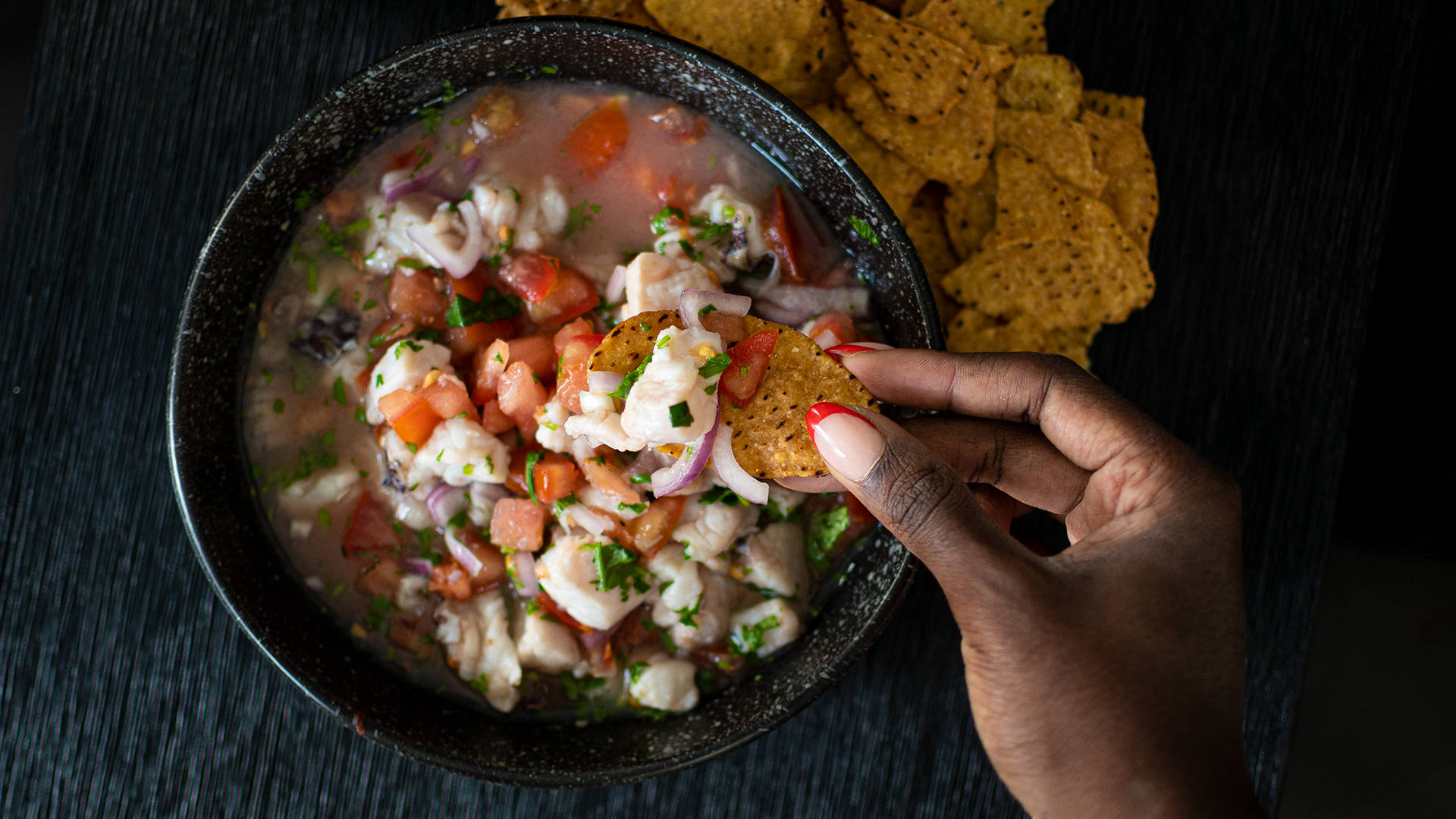 Dipping Corn Chips In Ceviche Wallpaper