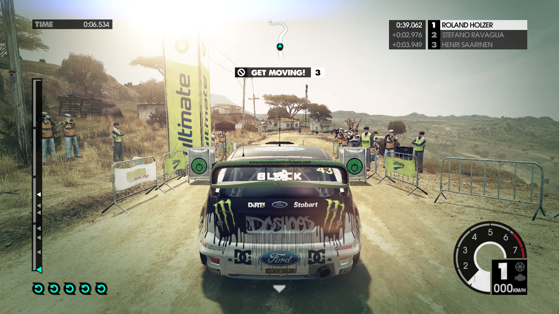 A Screenshot Of A Rally Game With A Car Driving Down A Dirt Road