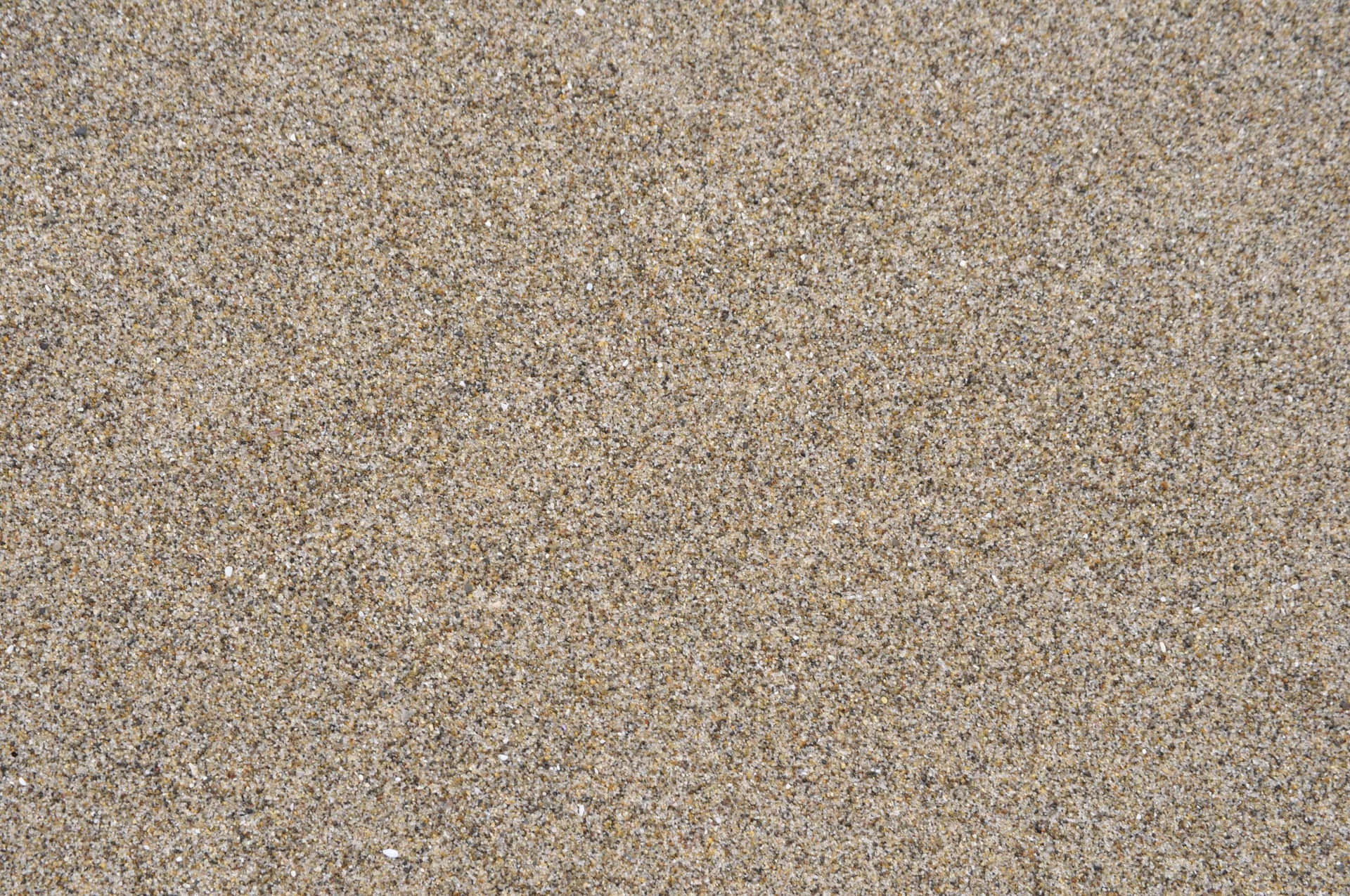 Unaspiaggia Di Sabbia Con Un Piccolo Castello Di Sabbia Bianca