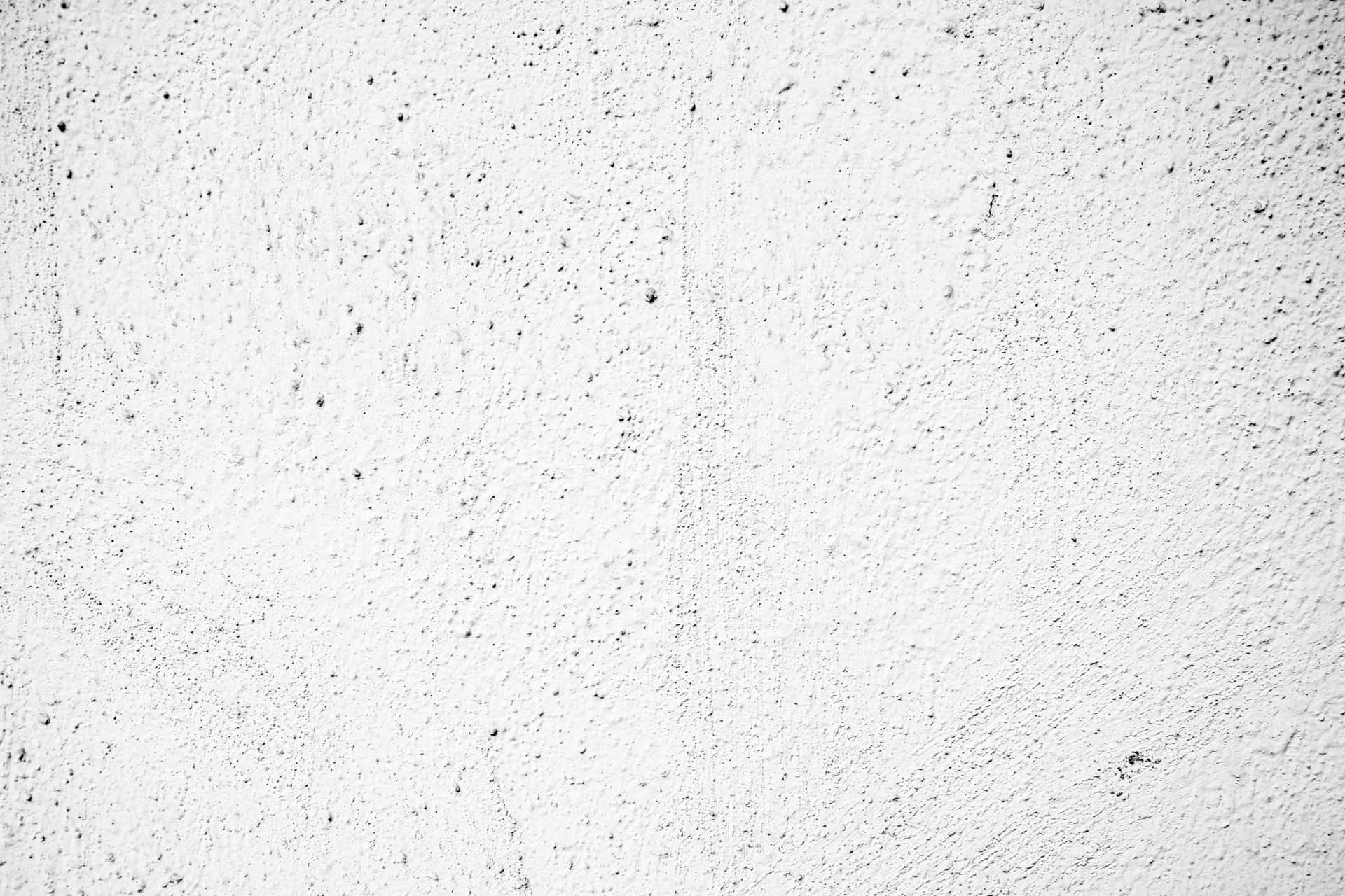 A White Wall With A Black Paint Texture