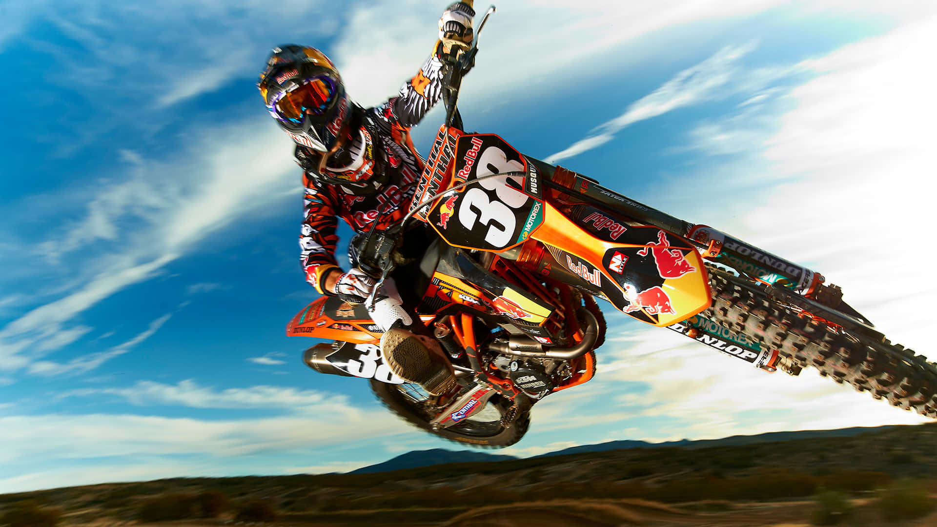 A professional dirt biker in action on a motocross track
