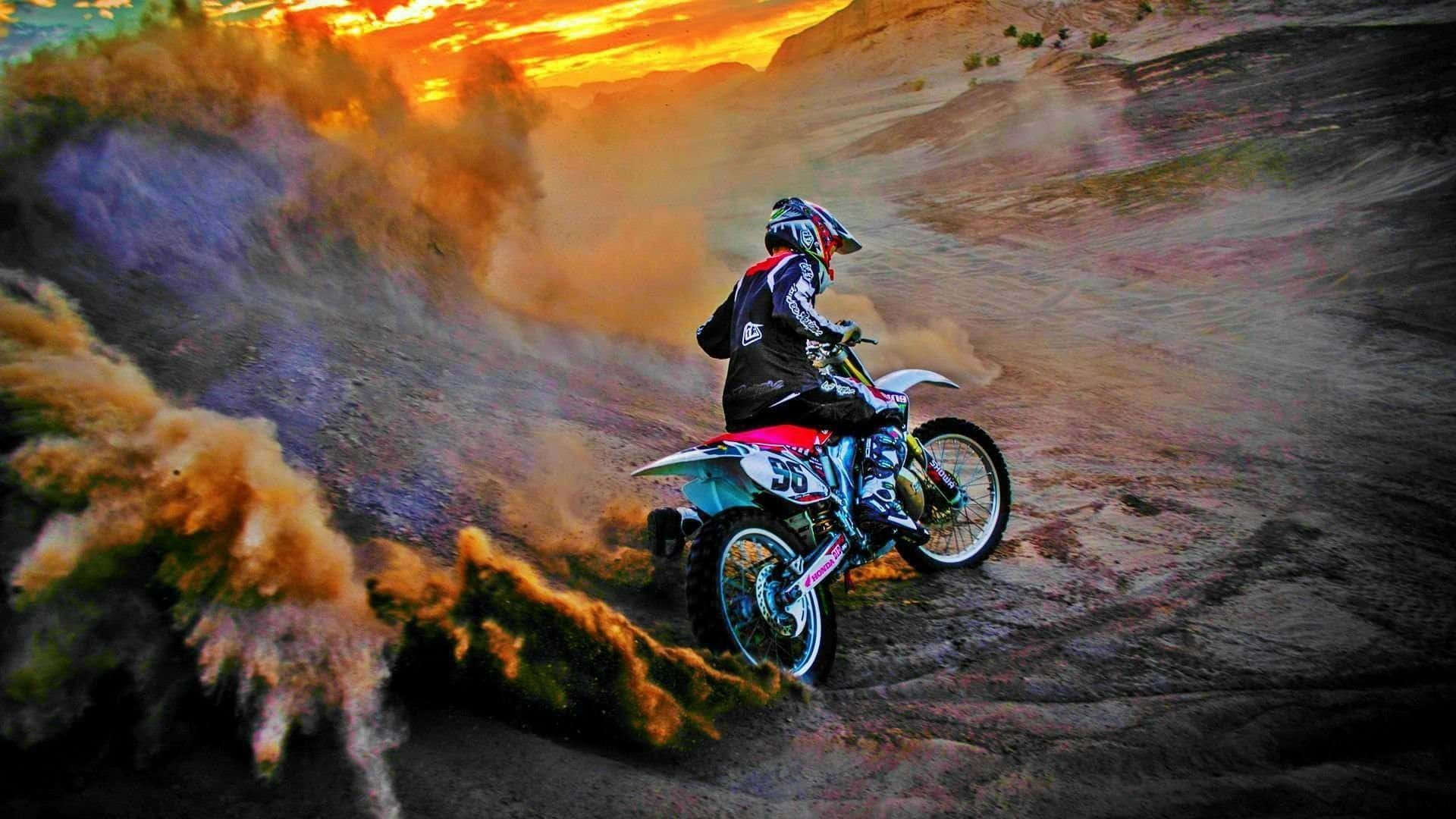 Professional dirt bike rider catching air on a thrilling outdoor track