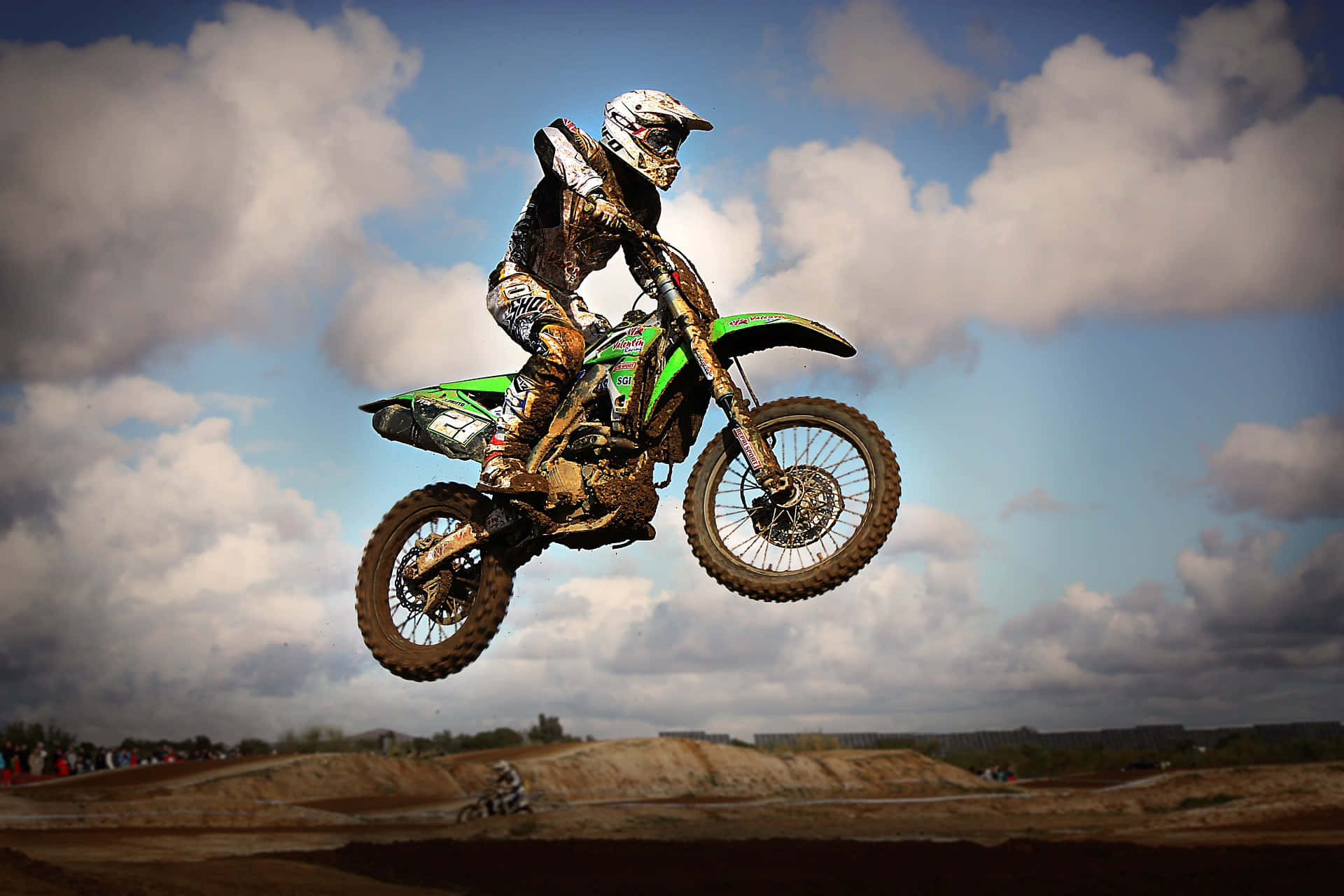 Professional Dirt Bike Rider Jumping High in a Scenic Location