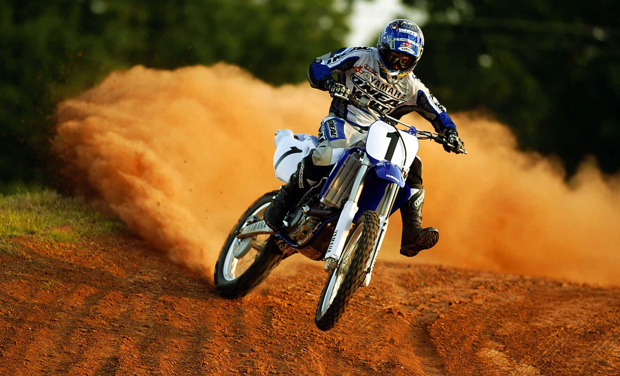 Dirt bike rider catching air on a thrilling outdoor track