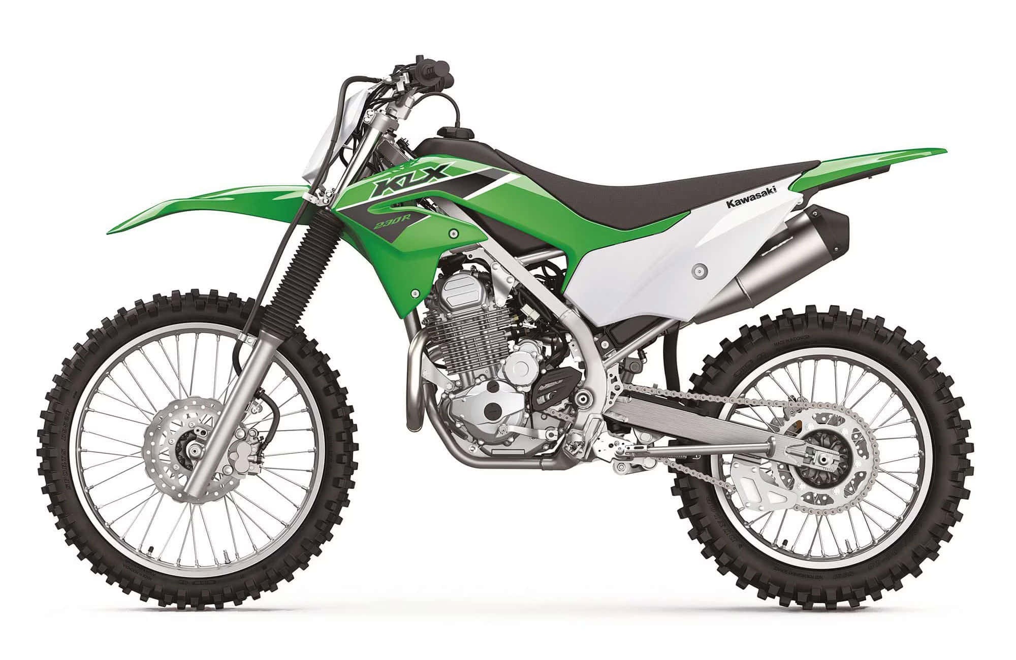 Vienemostrata Una Moto Da Cross Verde Su Uno Sfondo Bianco.