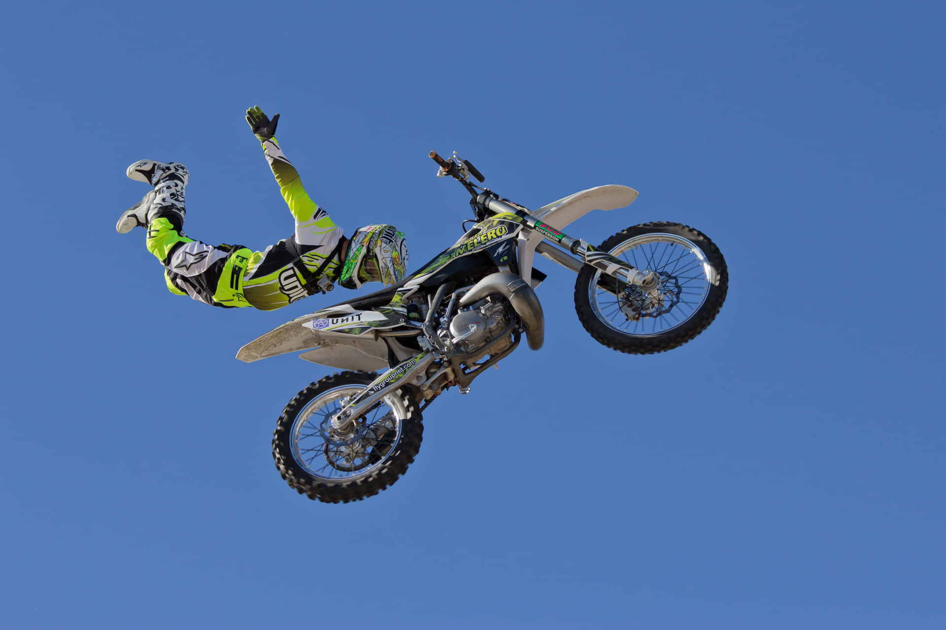 A Person Doing A Trick On A Dirt Bike