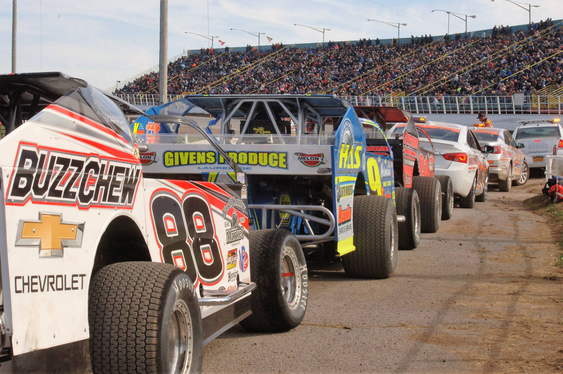 Dirt Car Lined Up On Track Wallpaper