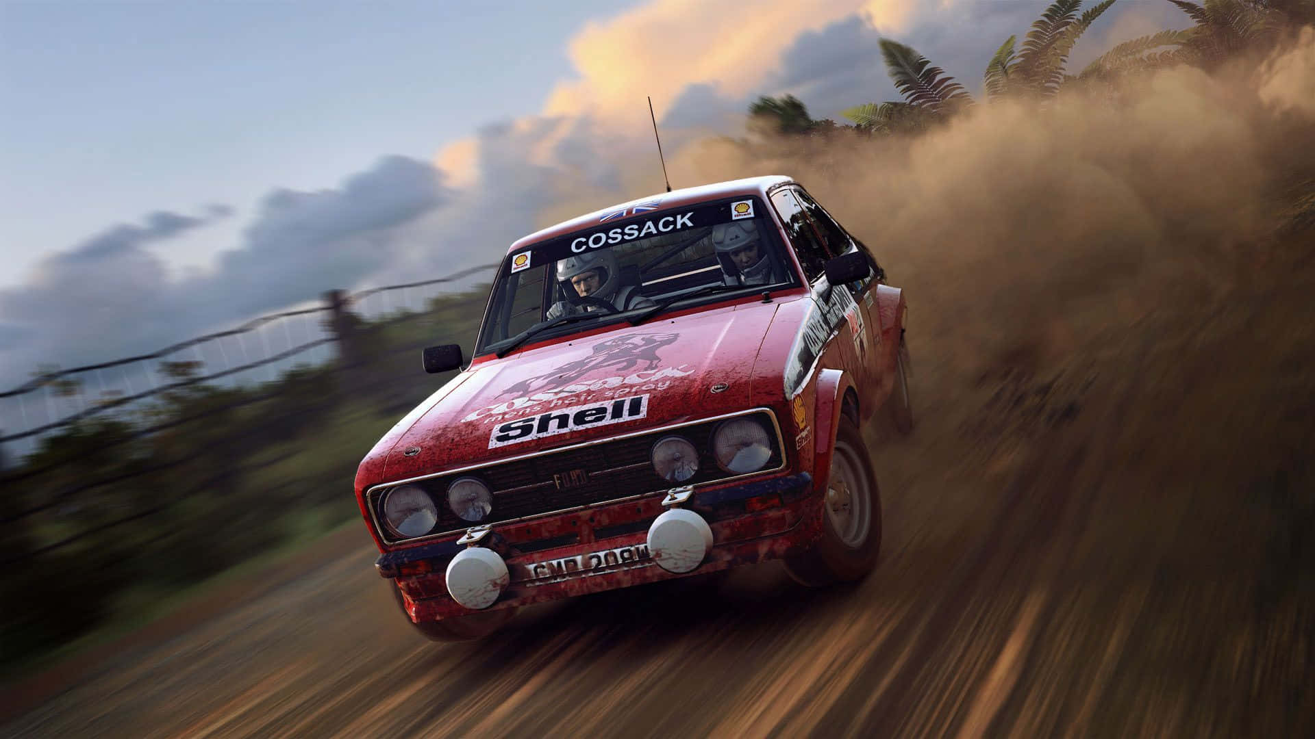 A Red Rally Car Driving On A Dirt Road