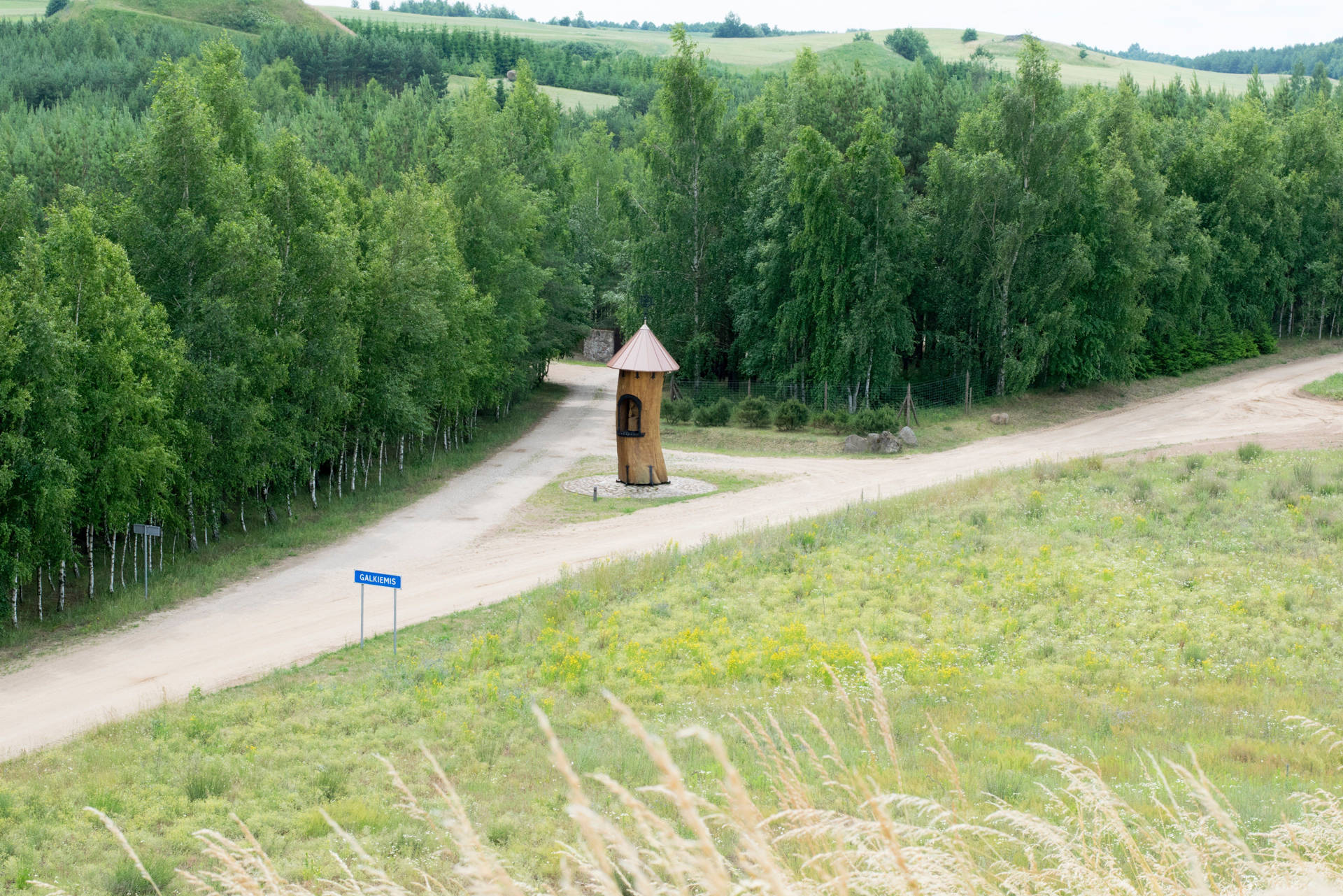 Dirt Road With Wooden Tower In Lithuania