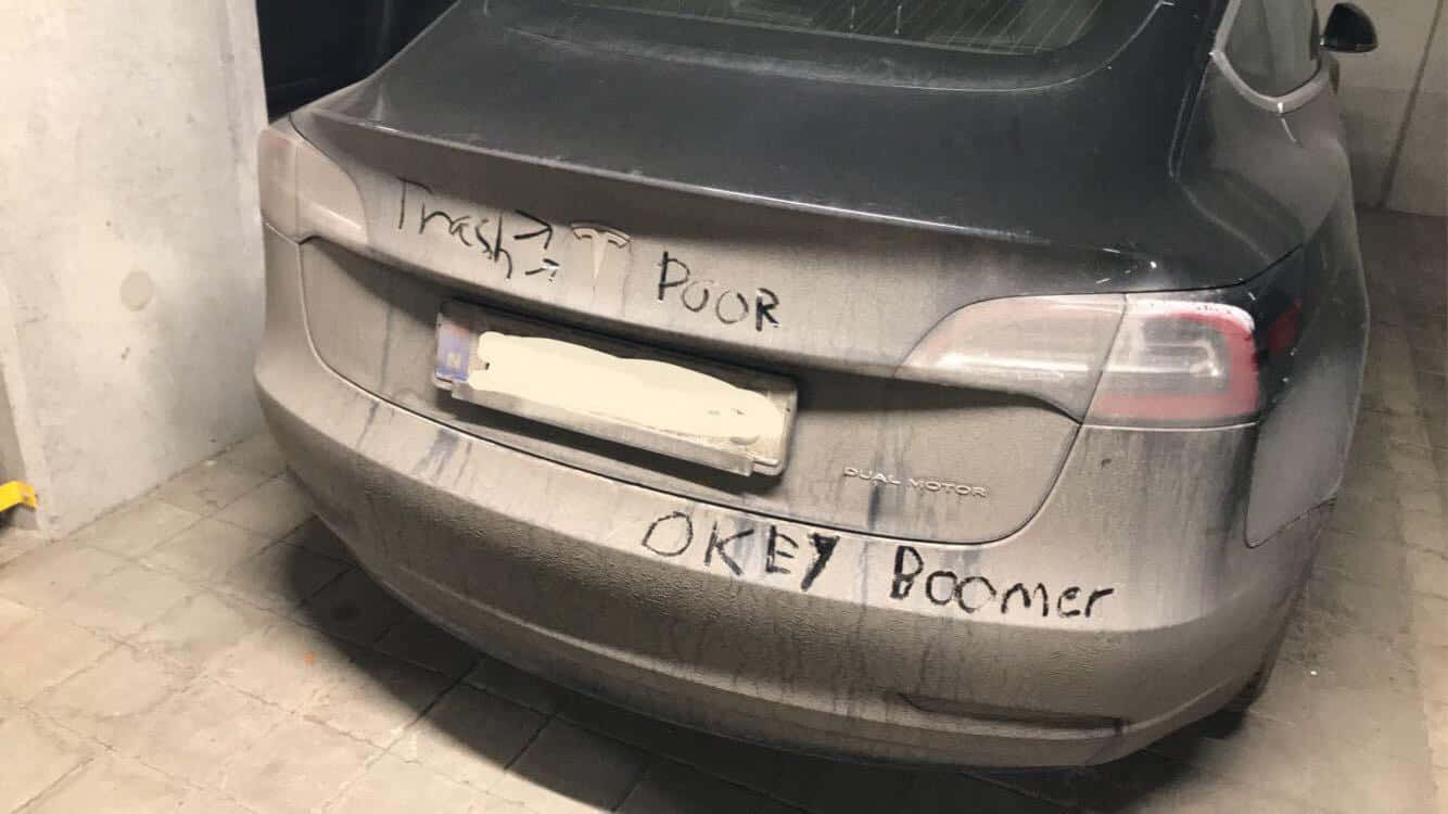 Tesla Model X - A Car With Graffiti On The Back
