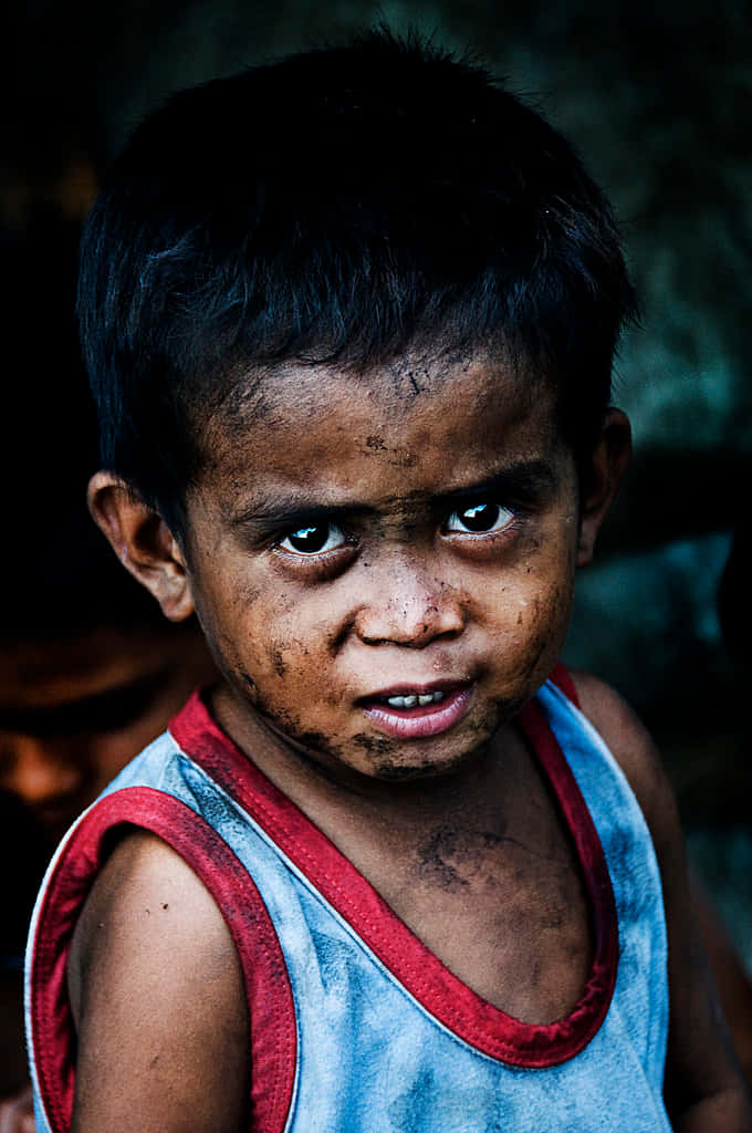 a boy with a dirty face
