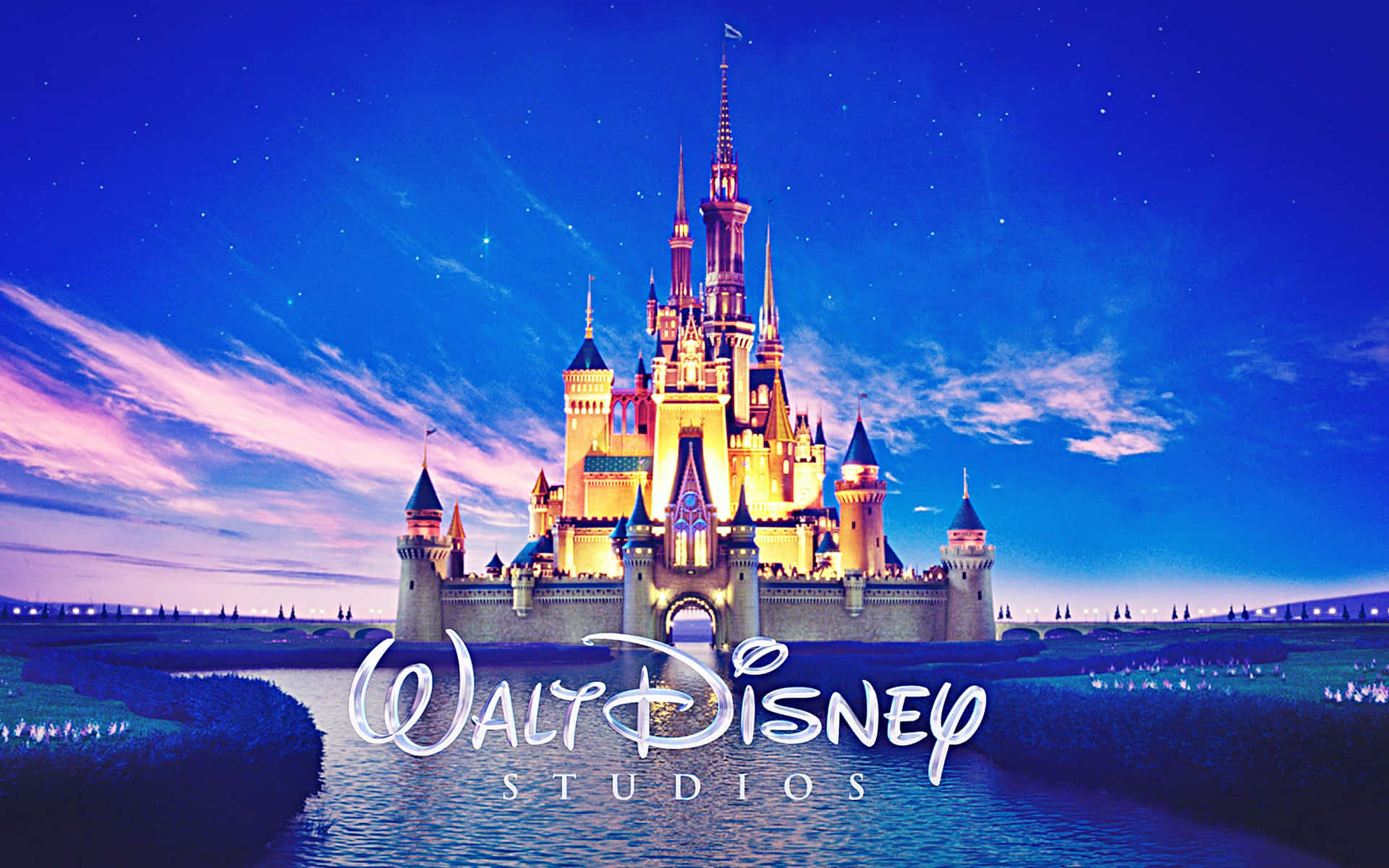 Logode Walt Disney Studios Con Un Castillo De Fondo. Fondo de pantalla
