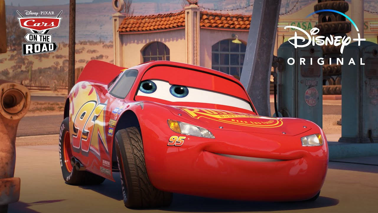 Lightning McQueen Speeding on the Race Track Wallpaper