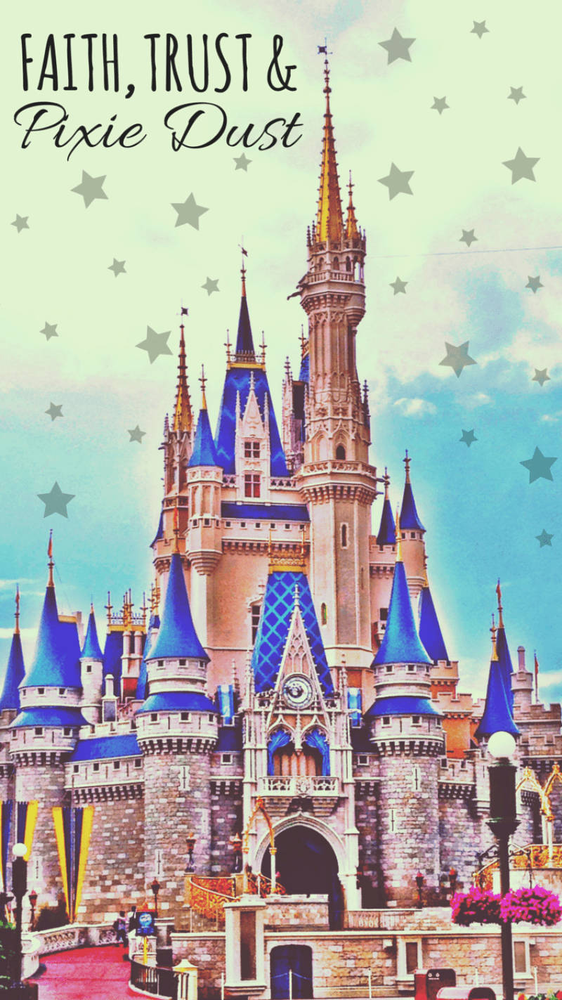 Disney Castle with blue roof on star-filled skies wallpaper
