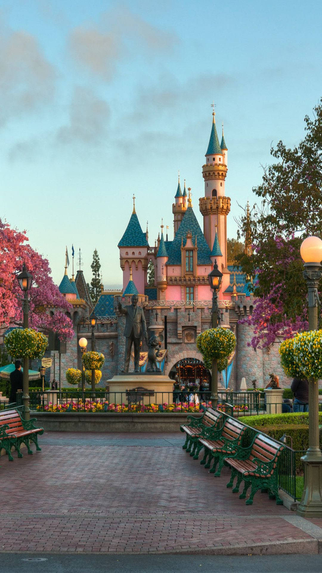 Magical Disney Castle Amidst Enchanted Gardens Wallpaper