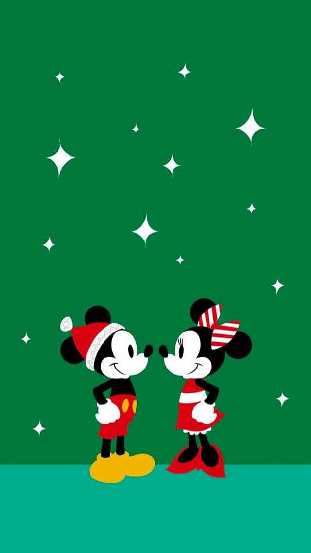 Mickey Mouse And Minnie Mouse In Christmas Hats Wallpaper