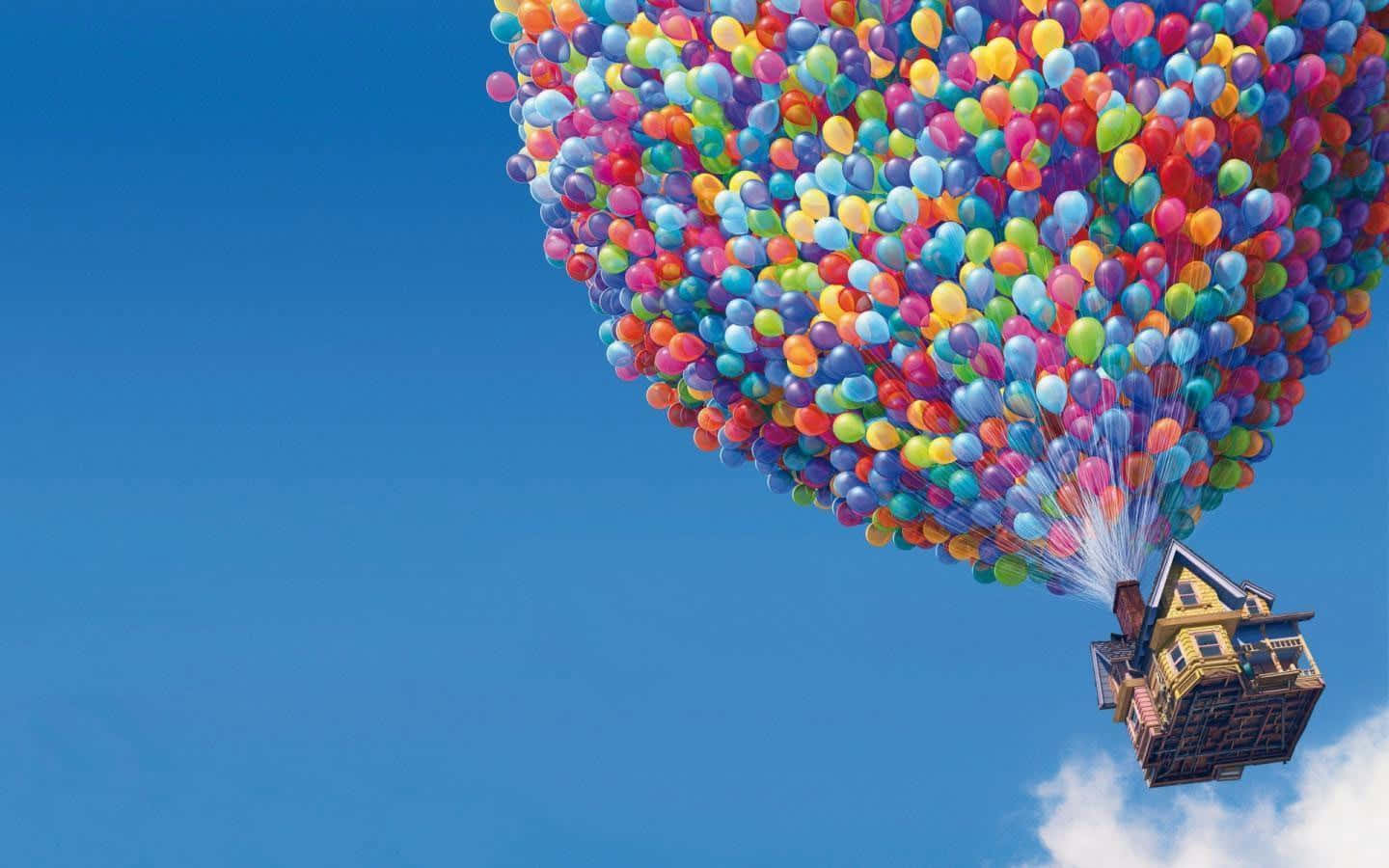 Disneydatorbakgrund Med Up-huset Som Flyger Med Ballonger. Wallpaper
