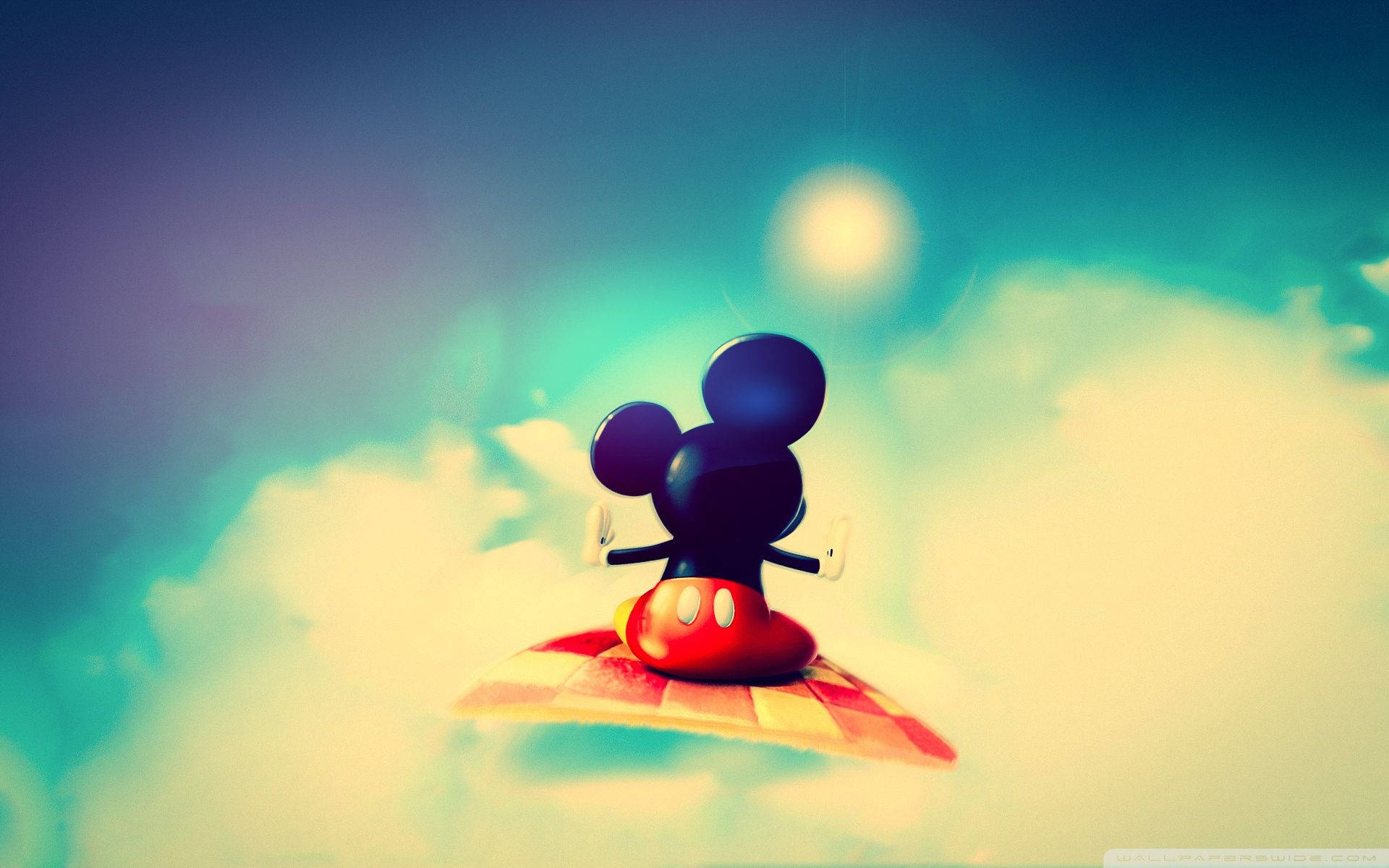 Join Mickey Mouse on a Magical Adventure in a Flying Carpet Wallpaper