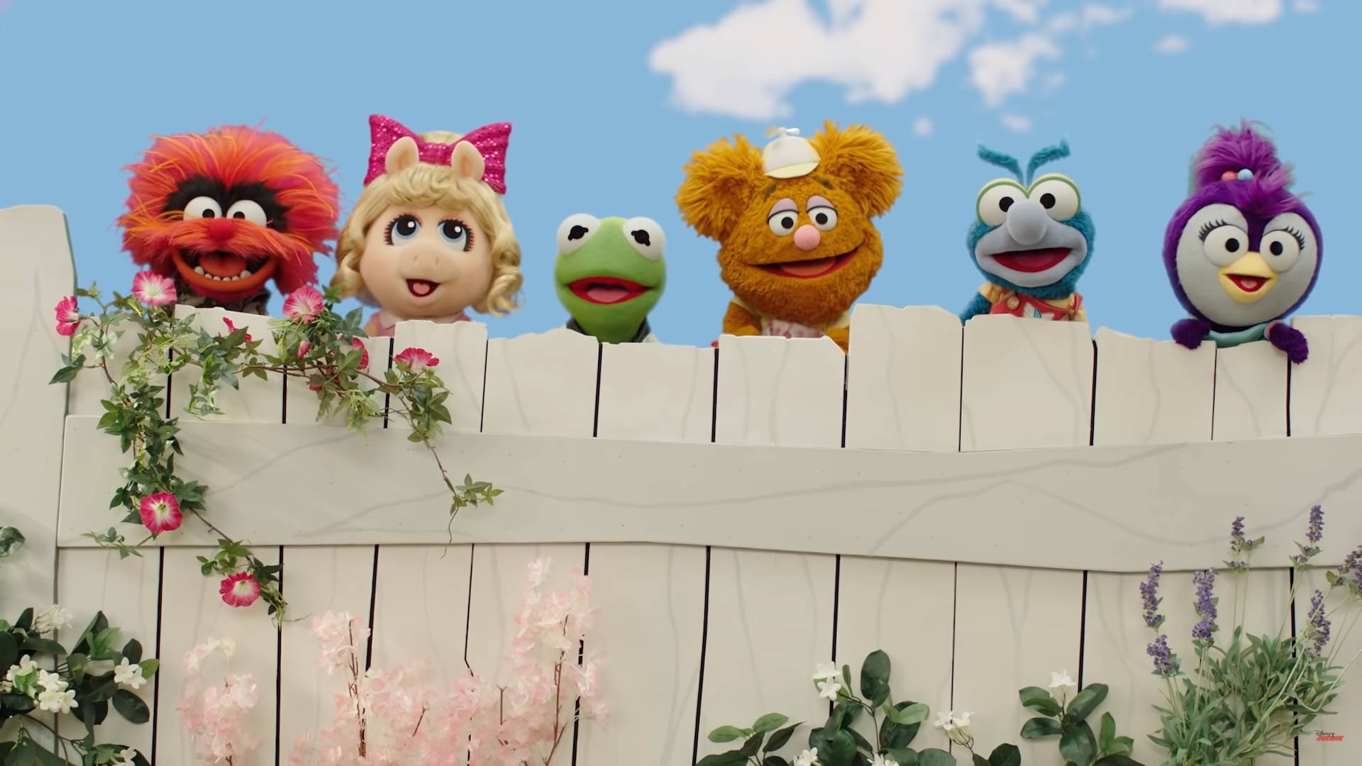 Disney Muppet Babies In Fence Background