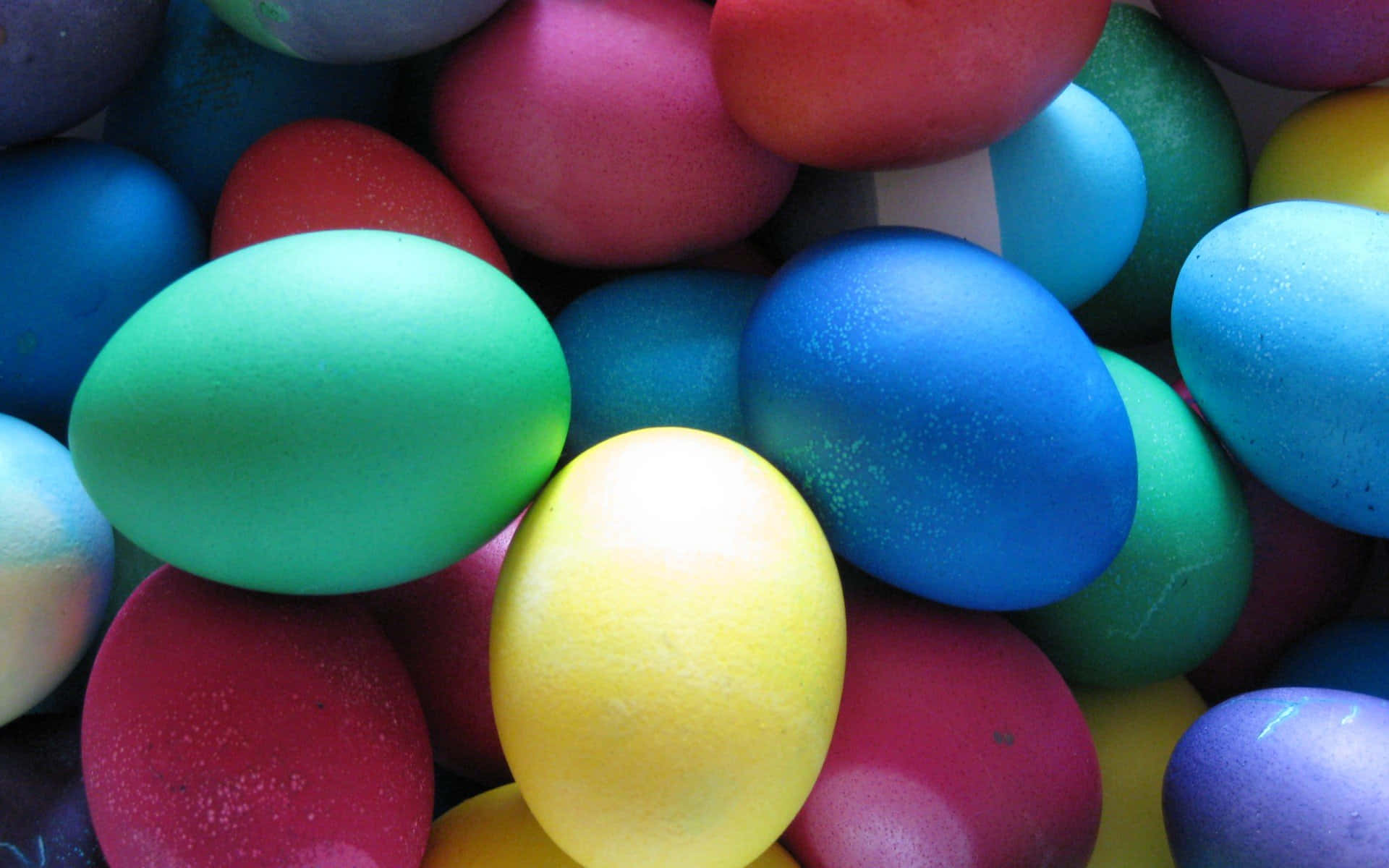 A Pile Of Colorful Easter Eggs Wallpaper