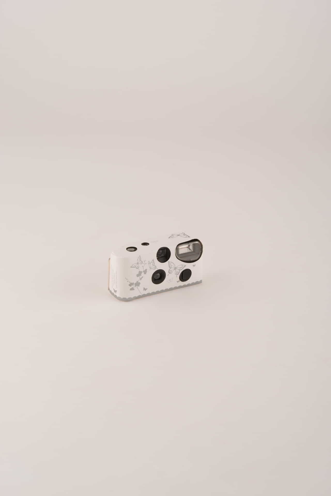 A White And Black Camera With Dots On It