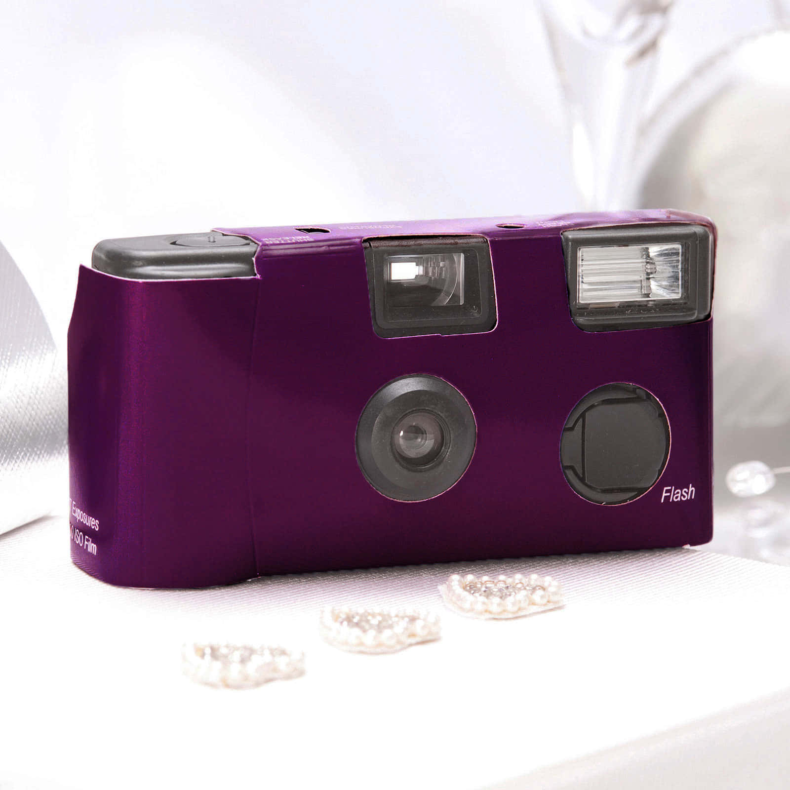 A Purple Camera On A White Table