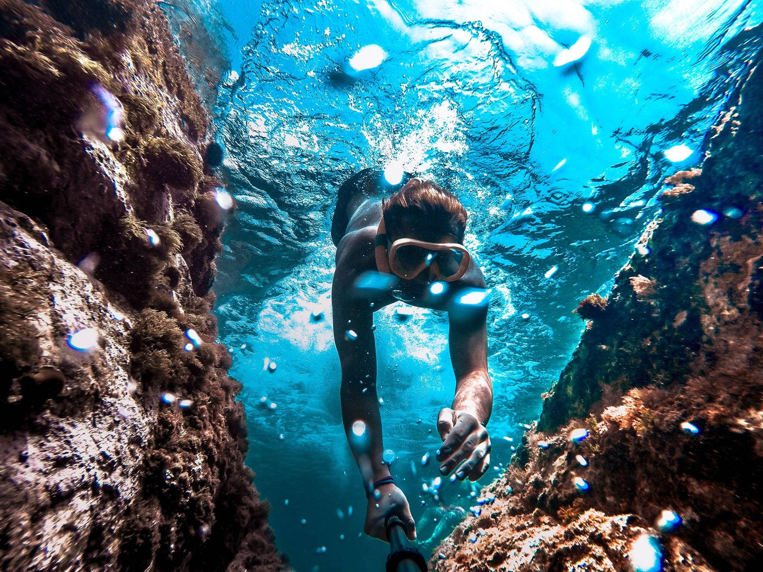 Diving Between Coral Reefs Wallpaper