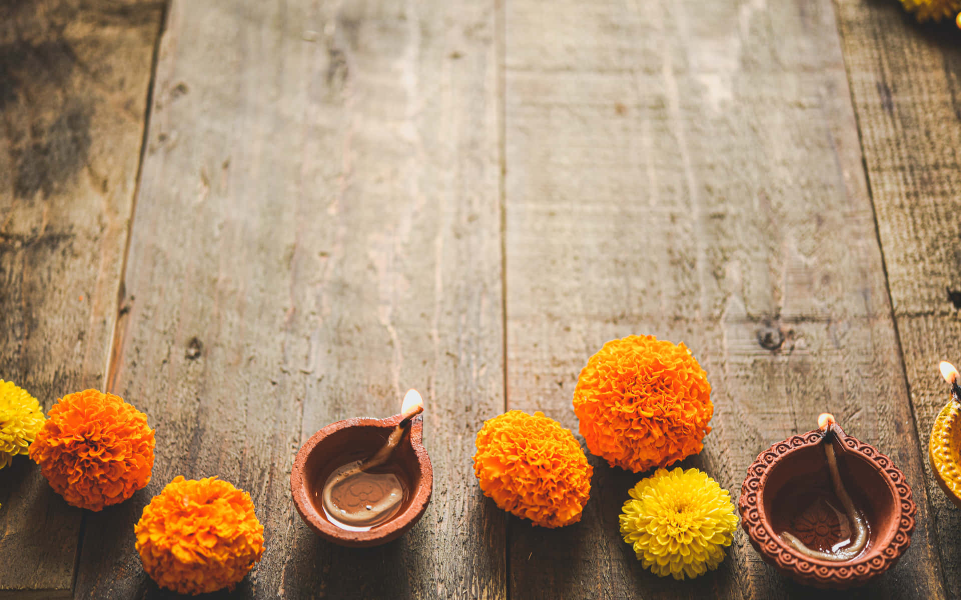 Diwali Candles And Marigold Flowers Background