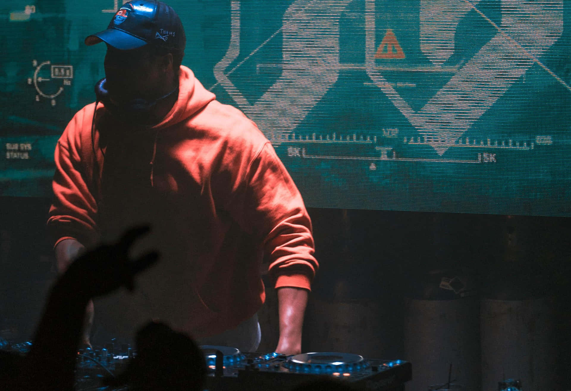 Energetic DJ Performing with Turntables at a Nightclub