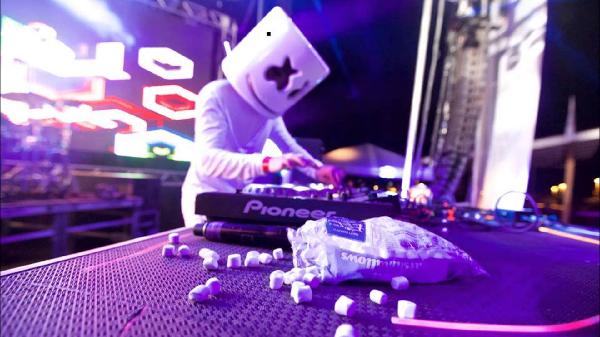 Catch neon vibes with DJ Marshmello's electrifying performance Wallpaper