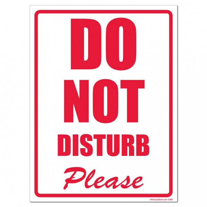 Please Do Not Disturb Sign Hanging On A Door Wallpaper